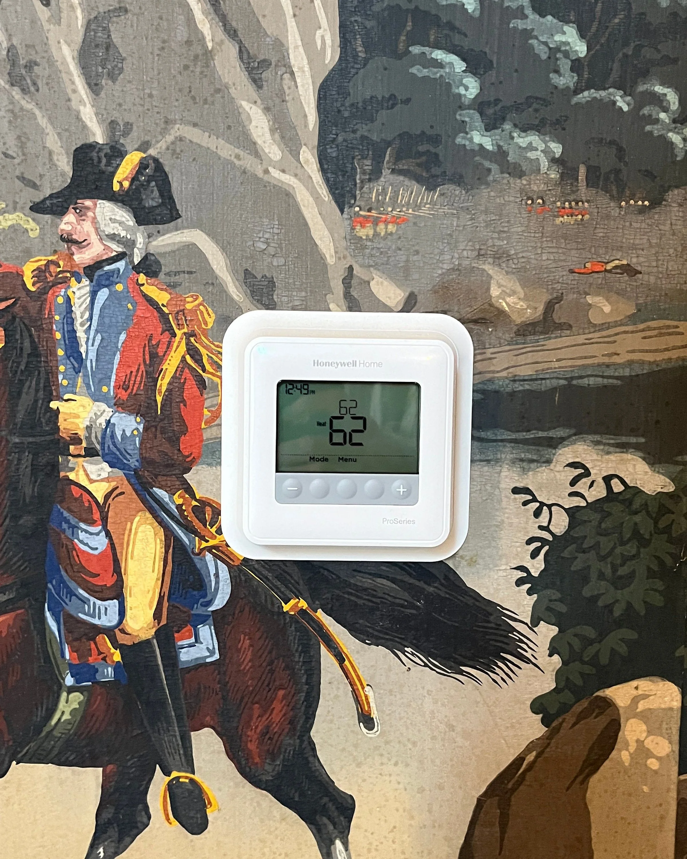 Hand-painted thermostat integrated into scenic wallpaper - before painting