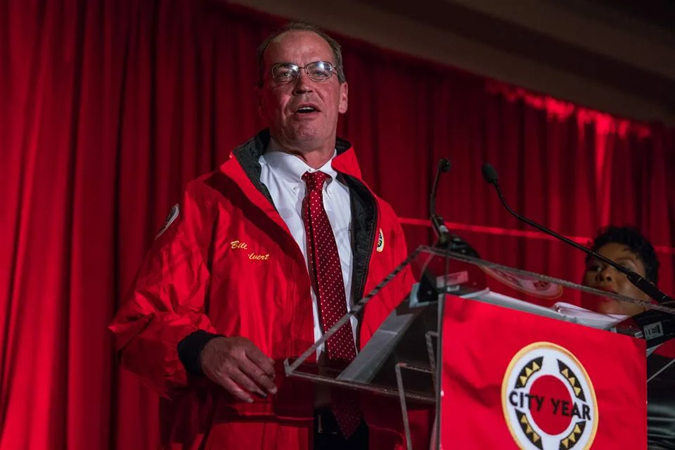 Bill Calvert presents Tanya Crawford and Donald Brown with their Red Jackets