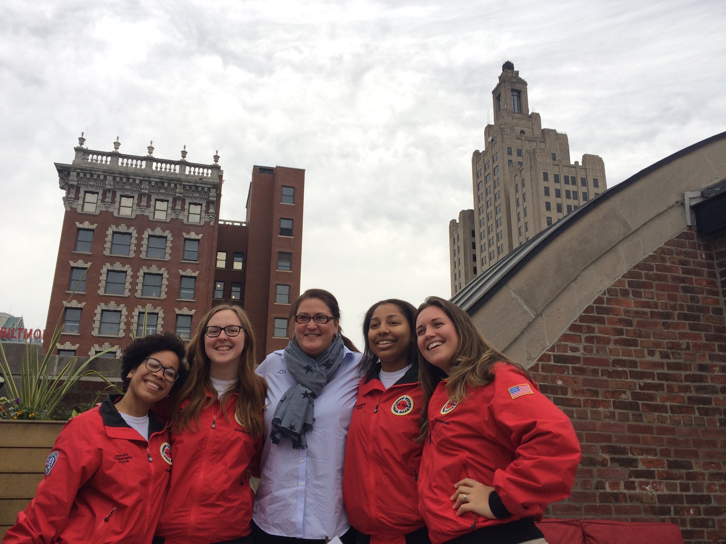 AmeriCorps members on the Bain Capital Team at Central High School with Julia Carlson, Principal of Central High School