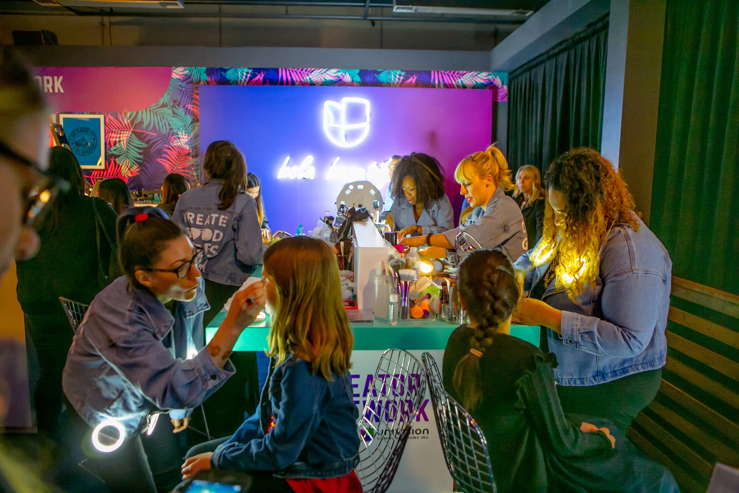 Spring Break guests receive makeovers and custom t-shirts at Univision’s booth