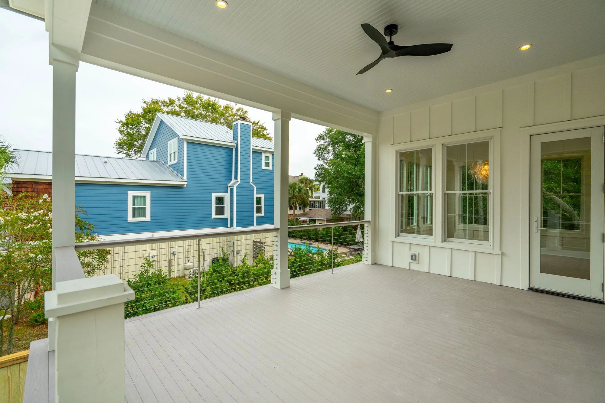 Covered rear porch for coastal outdoor living on Isle of Palms SC by Iconic Developments
