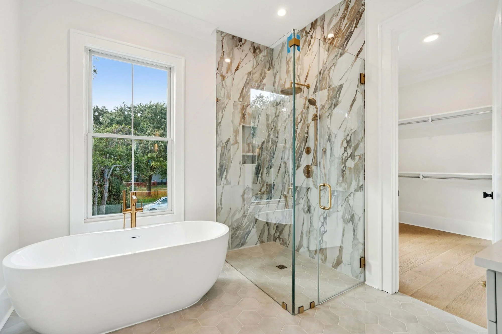 Primary bath with freestanding soaking tub in an Isle of Palms SC luxury custom home