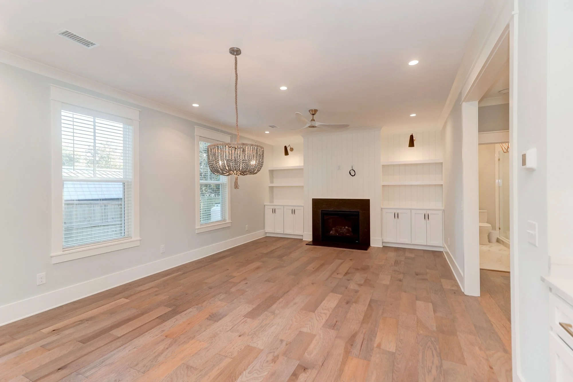 Living room gas fireplace in an Old Village Mount Pleasant SC home by Iconic Developments