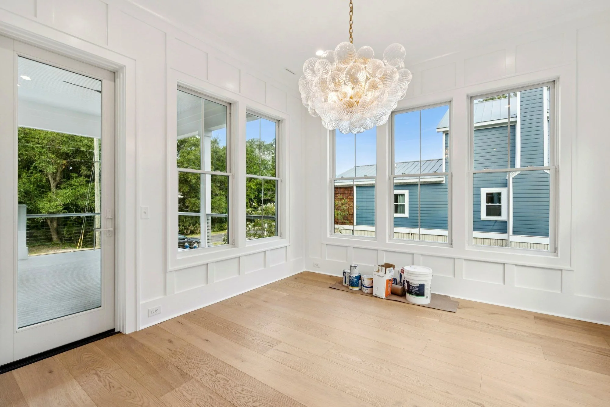 Dining room with glass bubble chandelier in an Isle of Palms SC luxury custom home