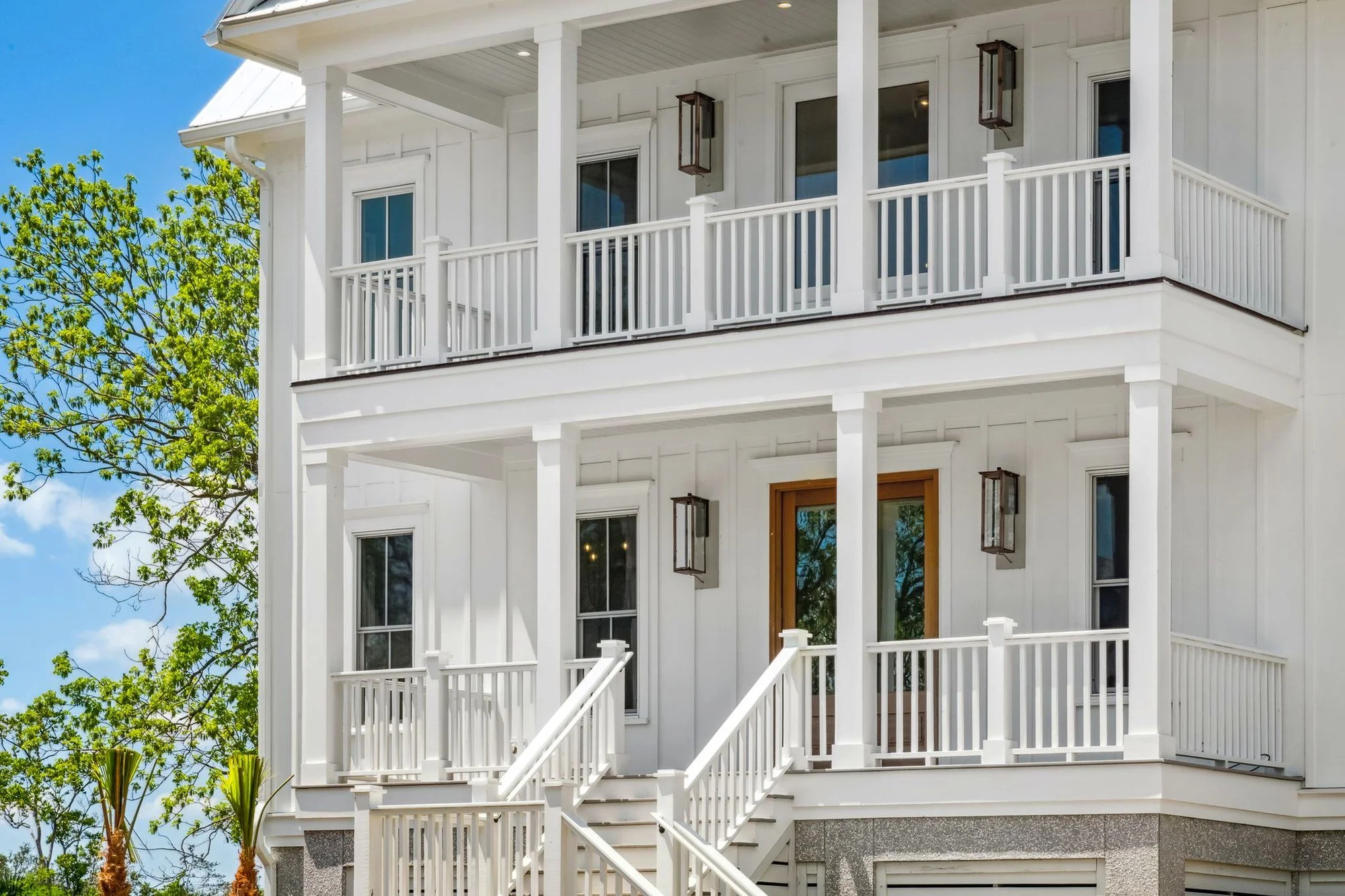 Double front porches on an elevated coastal custom home built on Daniel Island SC