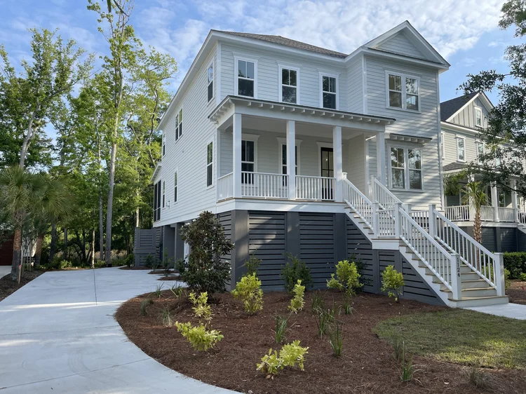 Elevated marsh-front custom home on Oak Overhang in Smythe Park, Daniel Island SC, built by Iconic Developments