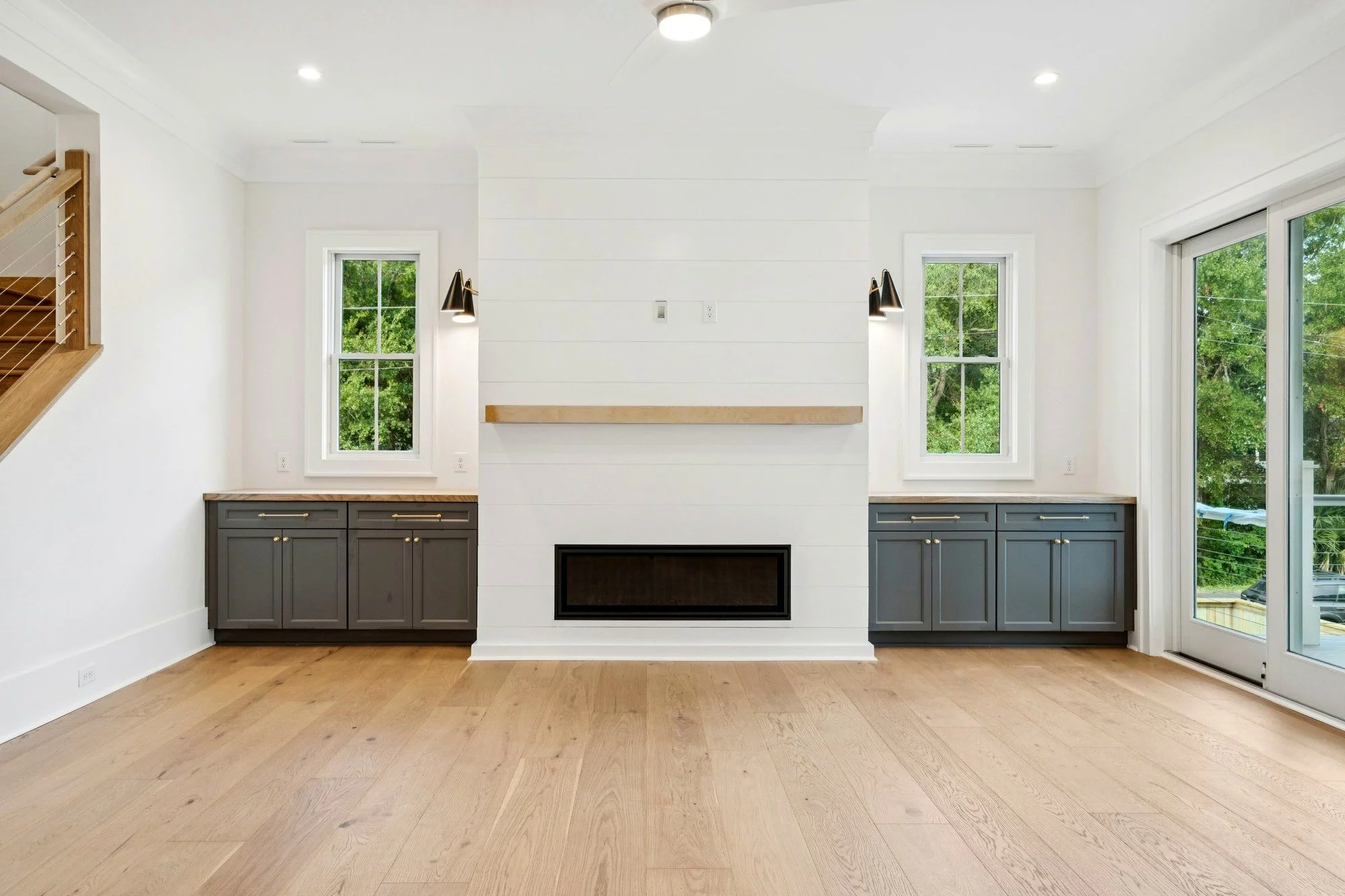 Great room with linear gas fireplace in a modern coastal Isle of Palms SC custom home