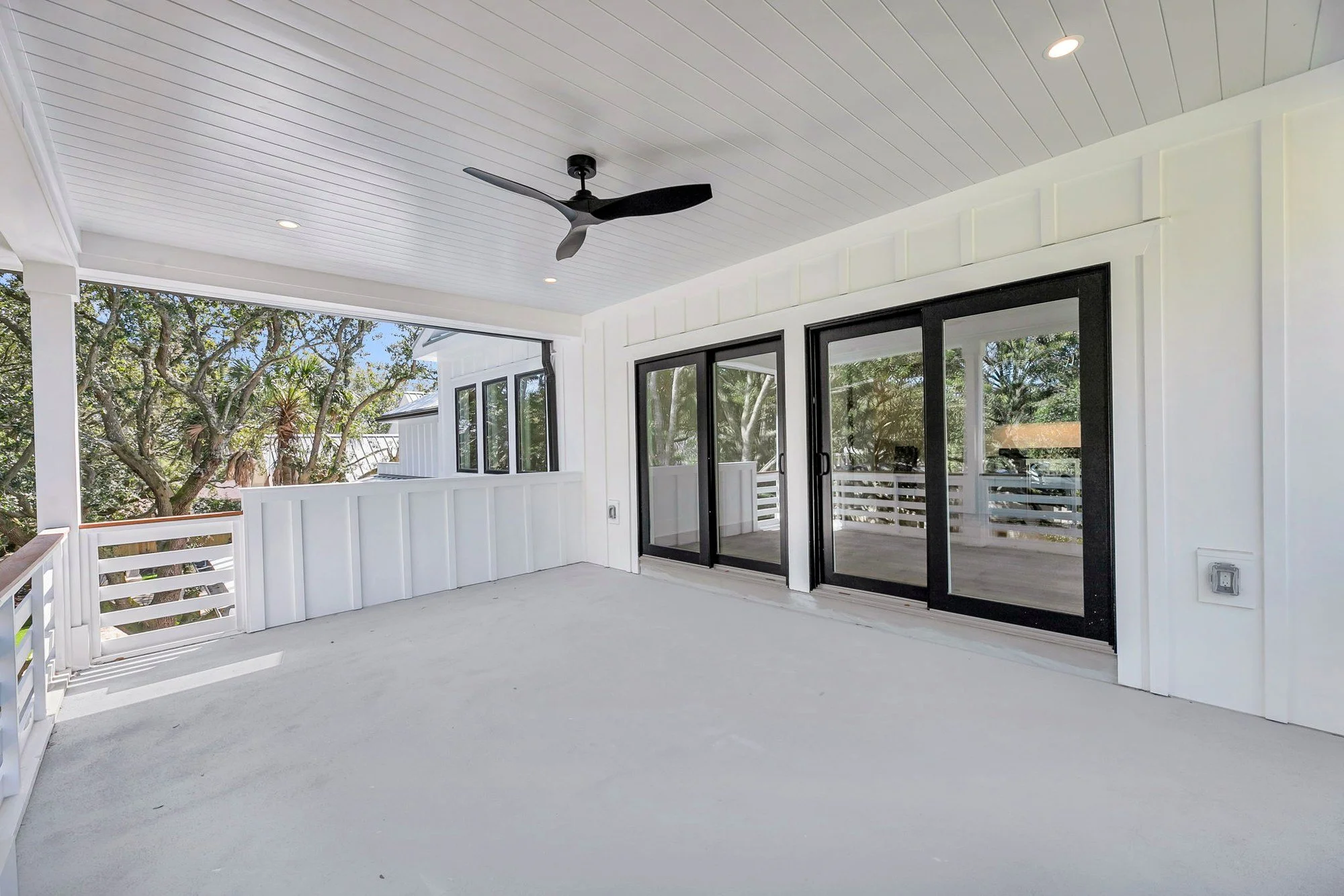 Upper-level covered porch with ocean breezes at a custom Isle of Palms SC home build