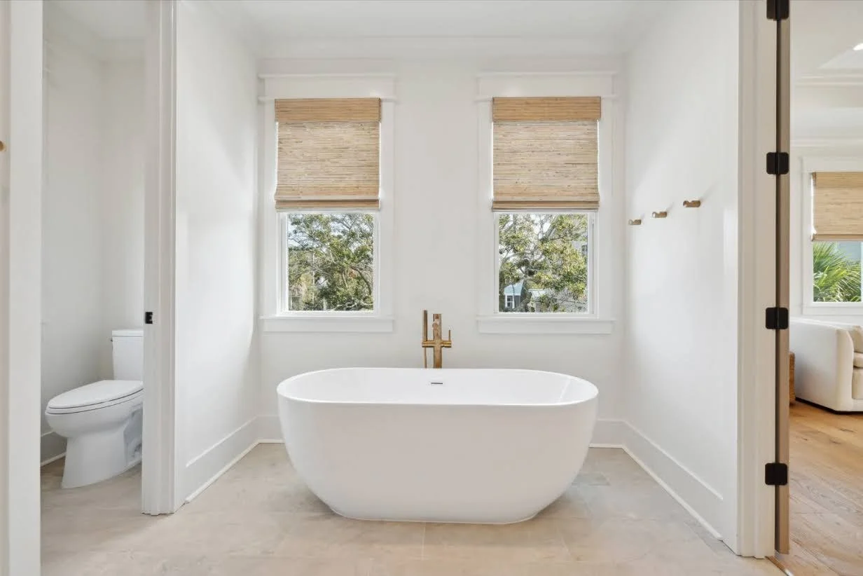 Owners bath with freestanding soaking tub in an Isle of Palms SC luxury custom home