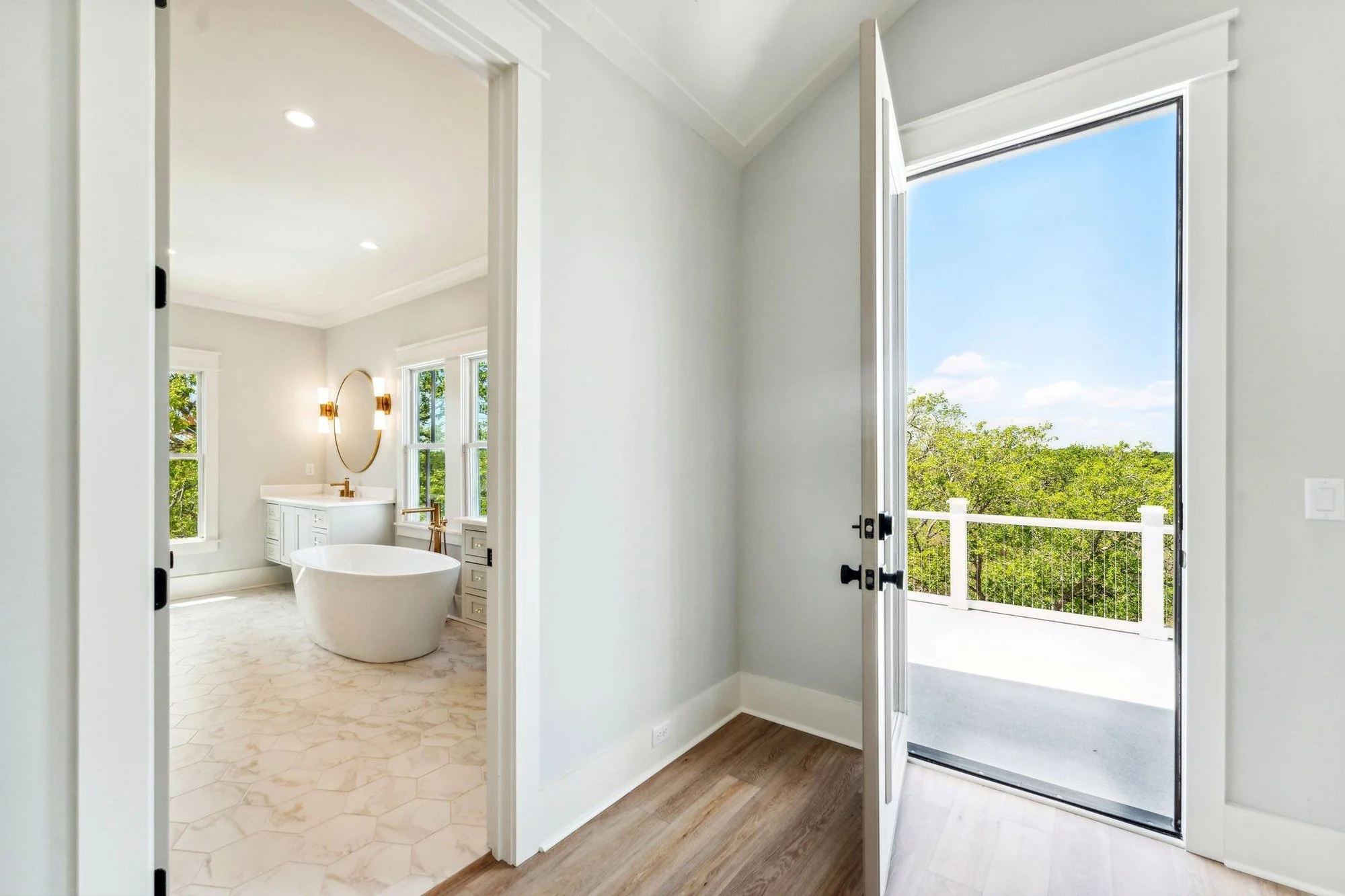 Primary bathroom featuring freestanding soaking tub and custom tile in Daniel Island SC