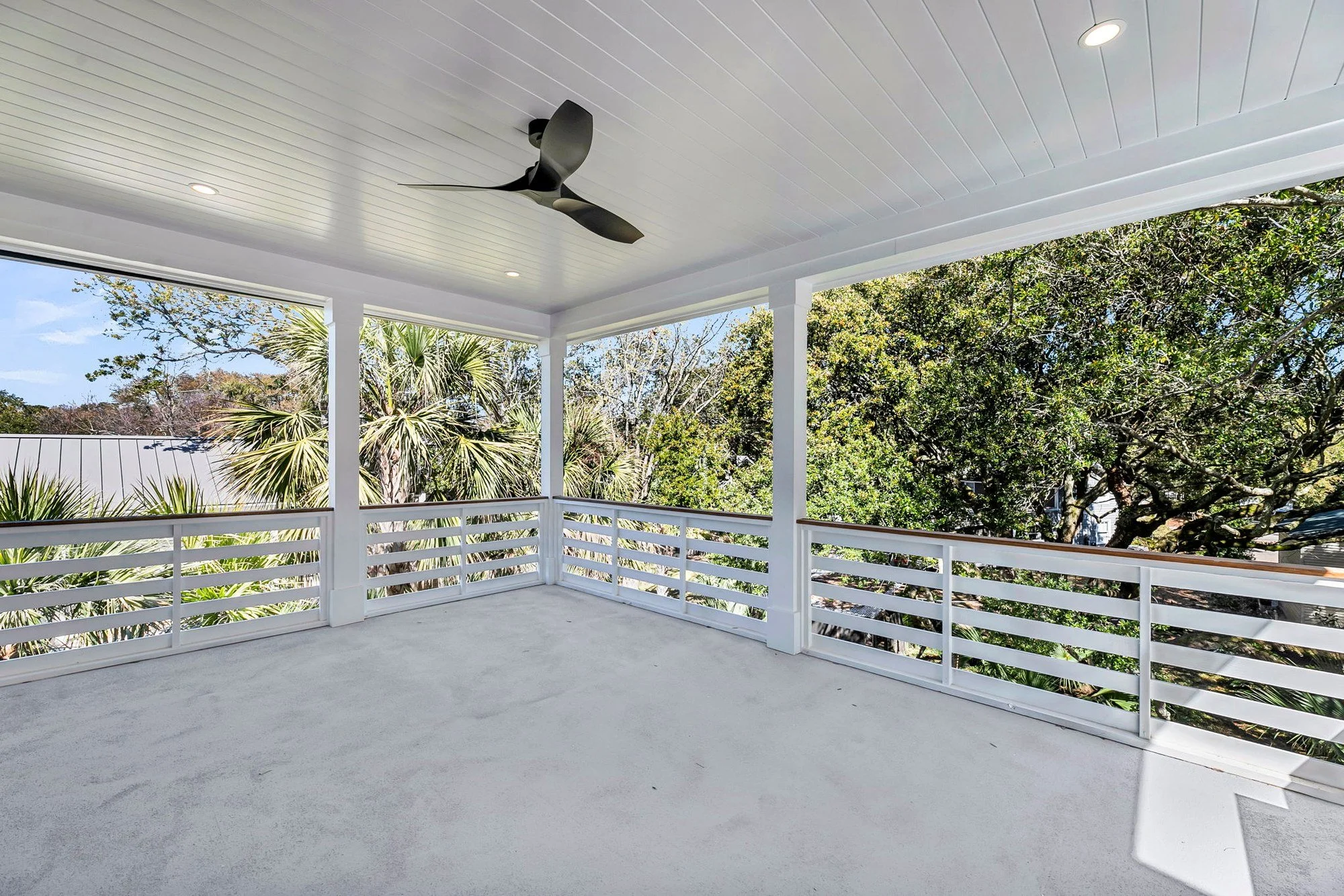Elevated screened porch for coastal outdoor living on Isle of Palms SC by Iconic Developments