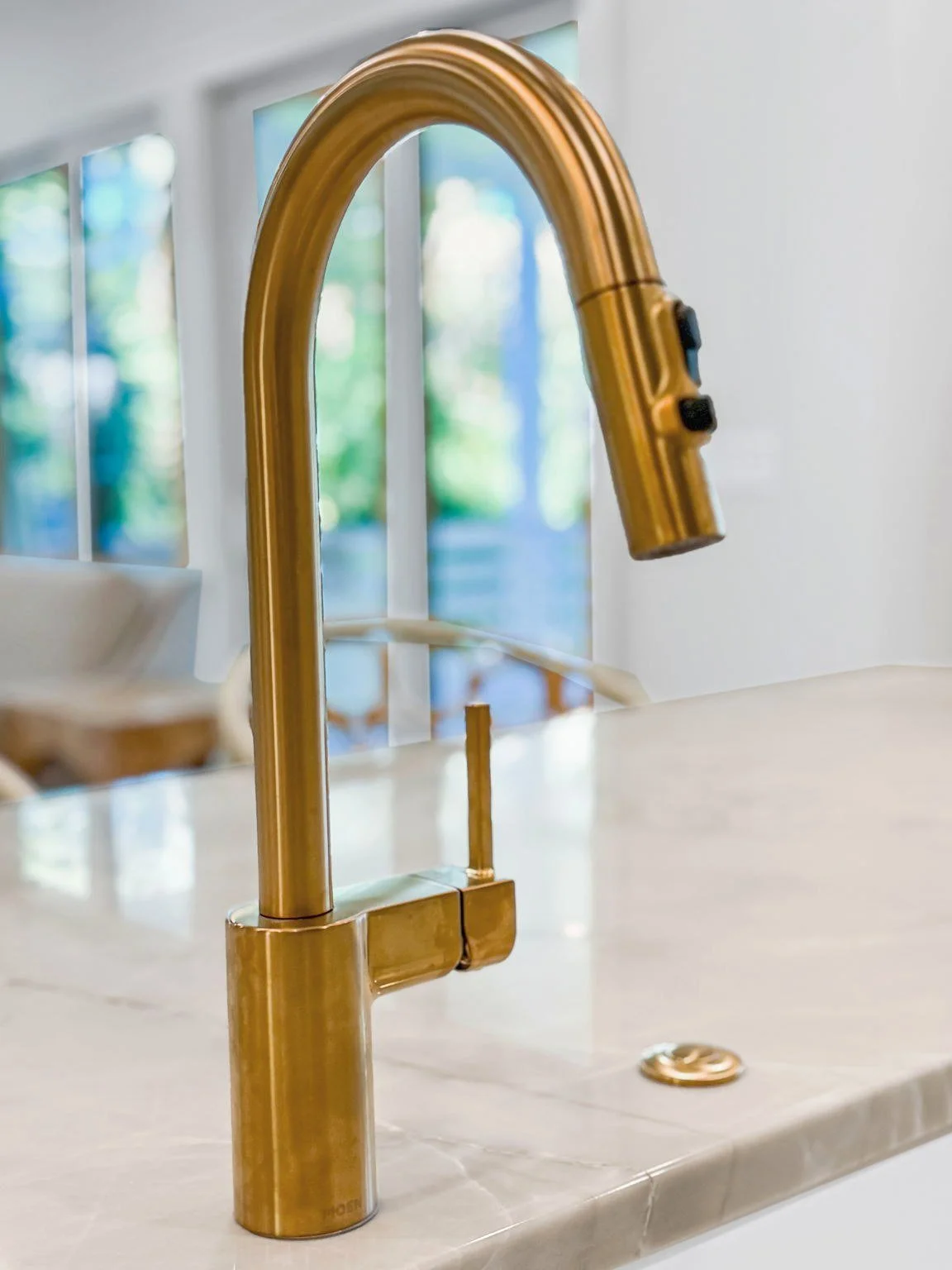 Brass gooseneck faucet detail in a custom Isle of Palms SC kitchen by Iconic Developments