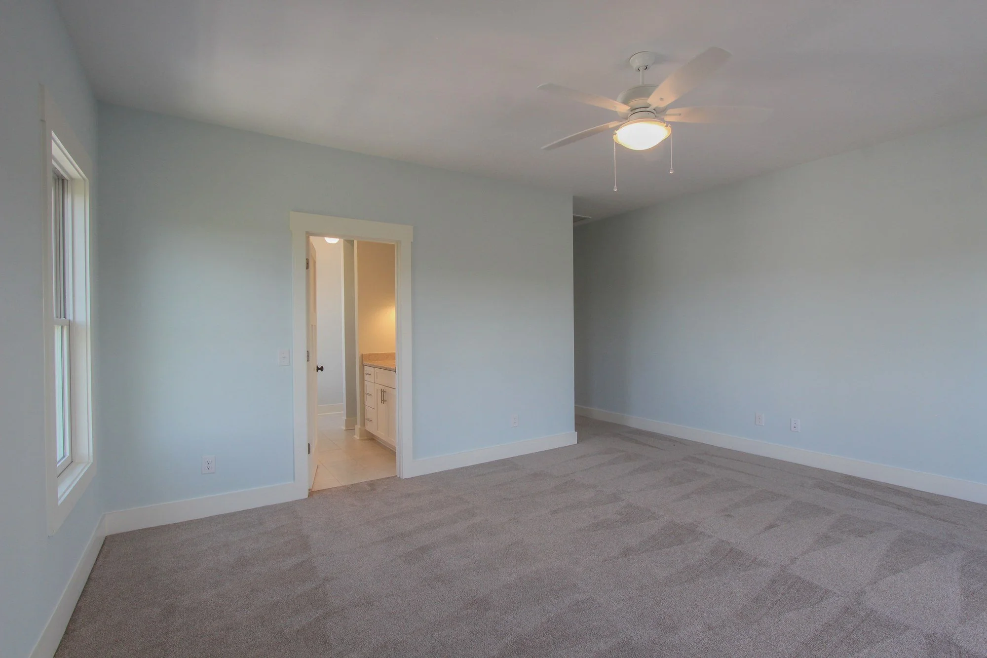 Guest bedroom with private en-suite bath in a Charleston SC luxury custom home build