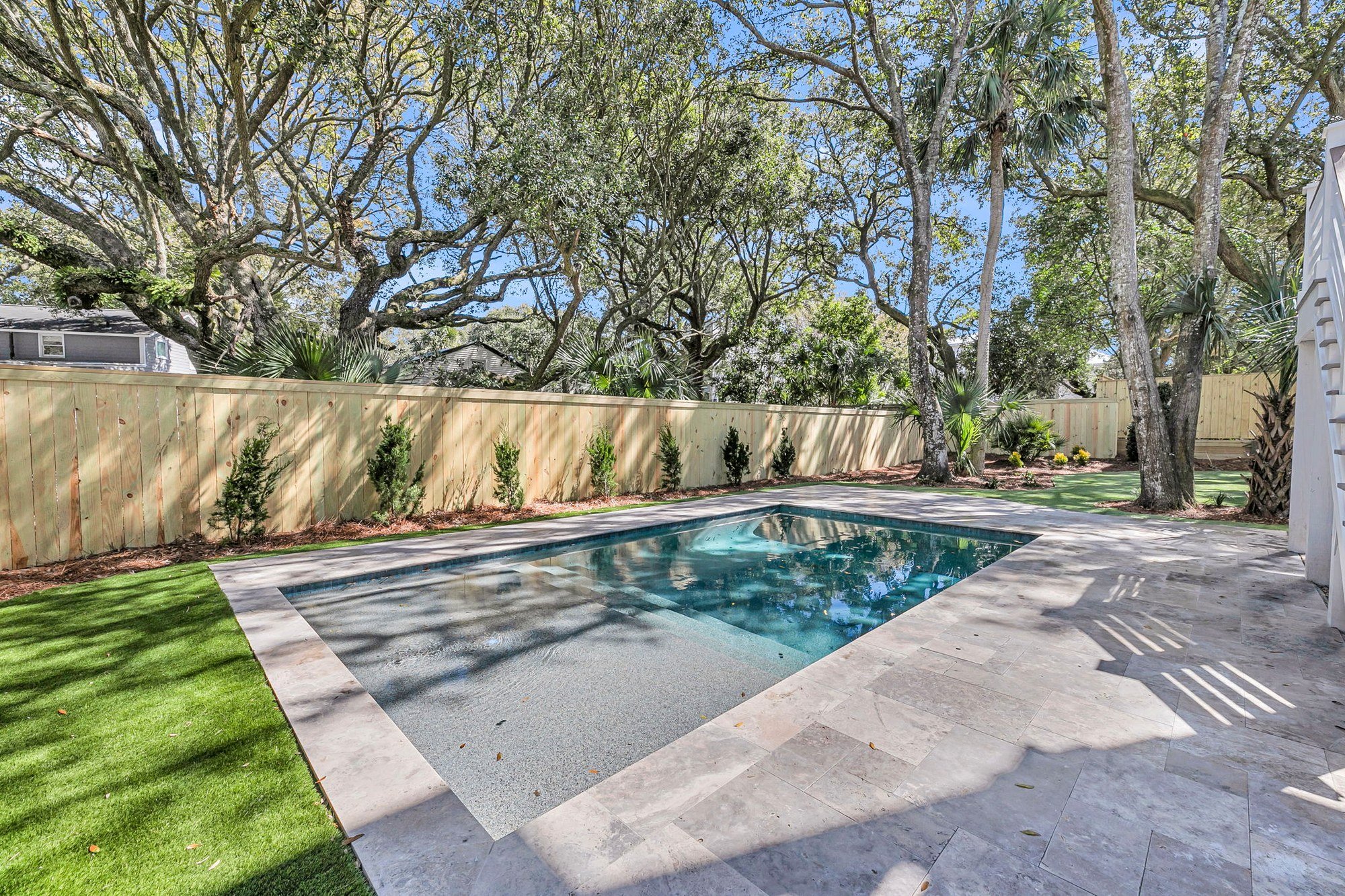 Custom gunite pool and travertine pool deck at an Isle of Palms SC luxury home build