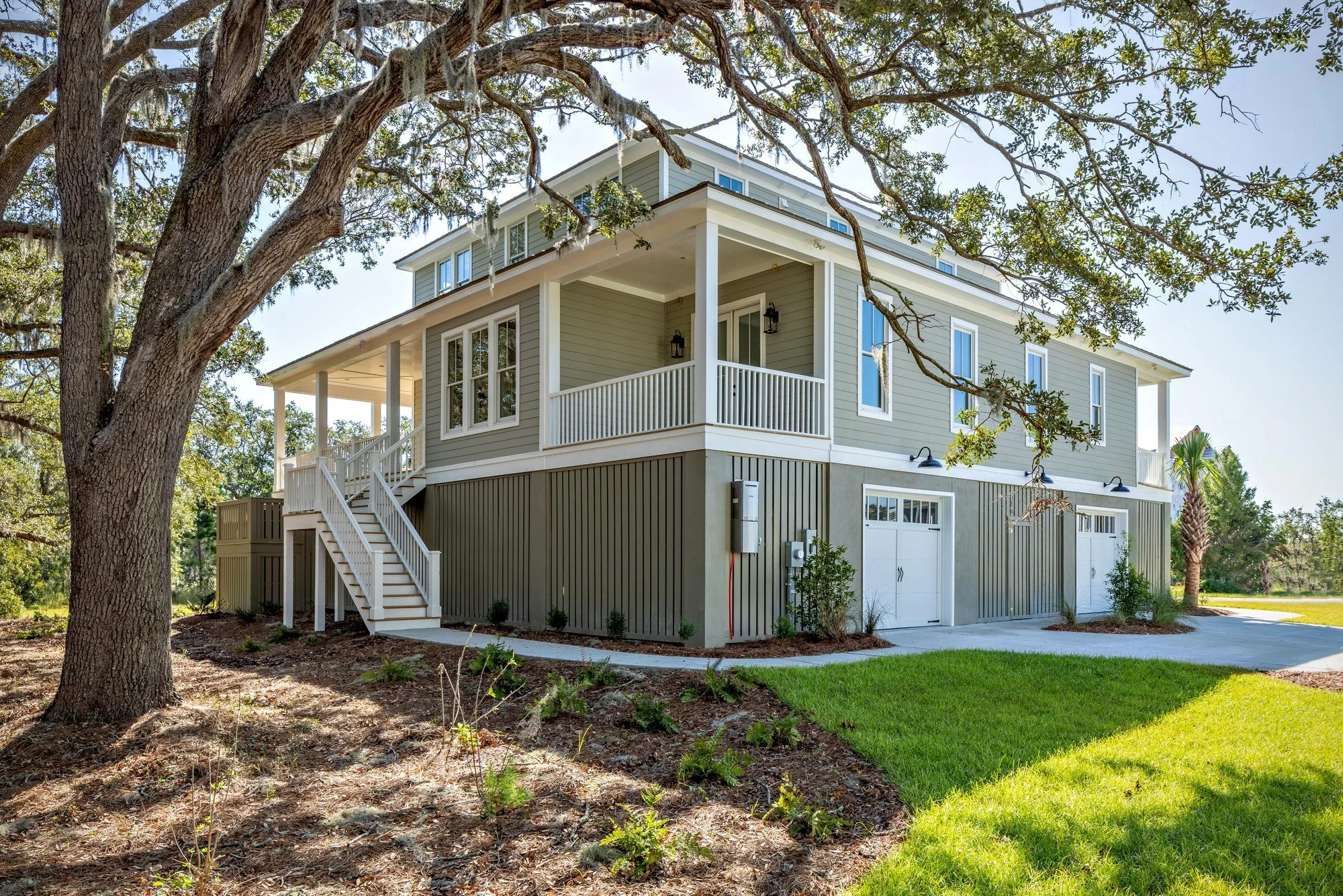 Carriage-style garage doors on a custom Johns Island SC home by Iconic Developments