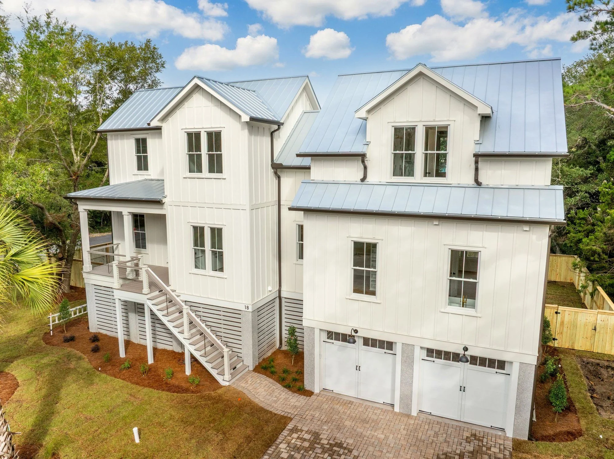 Aerial view of the front elevation and garages at 18 Wills Way on Isle of Palms SC