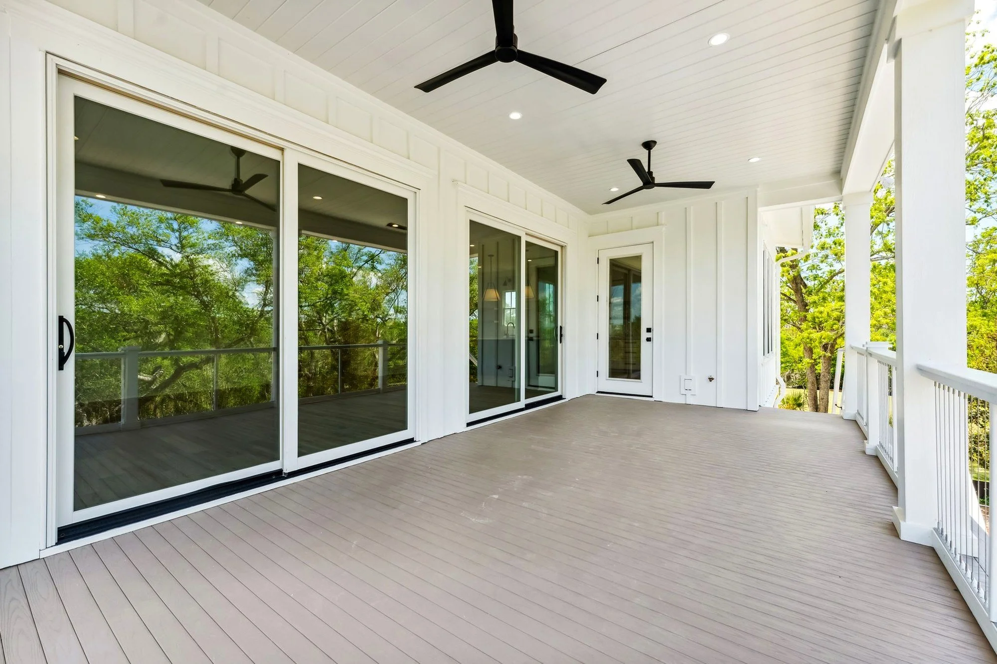 Elevated screened porch with tongue and groove ceiling in a Daniel Island SC custom home