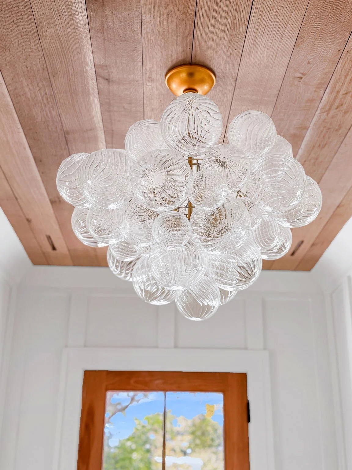 Glass cluster chandelier in the entry foyer of an Isle of Palms SC luxury custom home