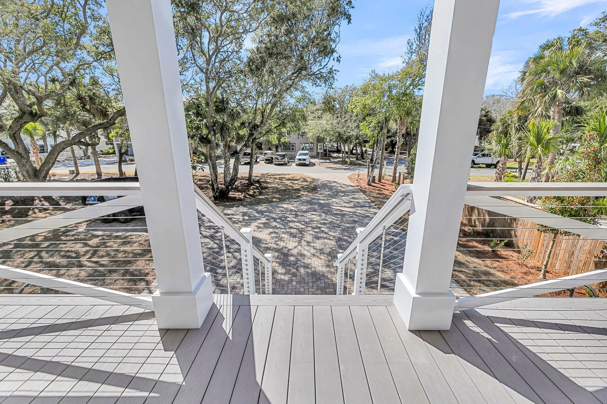 Front porch with stainless cable railing on a modern coastal Isle of Palms SC home build