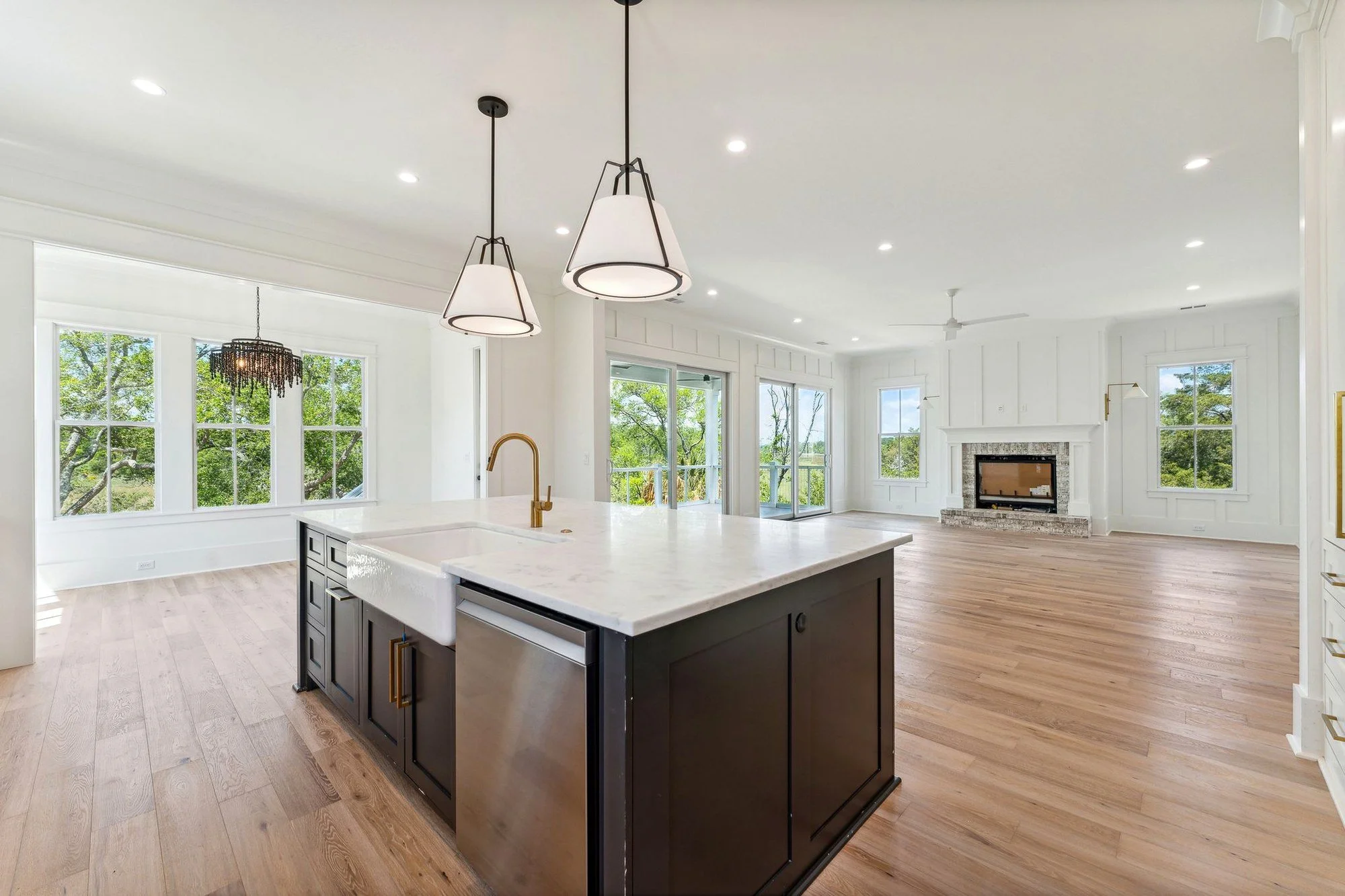 Custom kitchen island with blackened pendants in a Daniel Island SC luxury home build