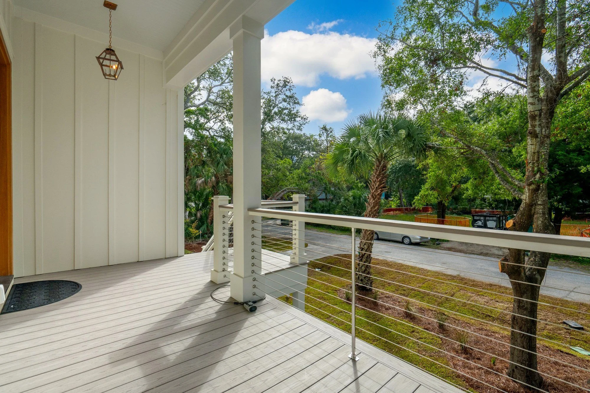 Front porch with cable railing on a coastal Isle of Palms SC home by Iconic Developments