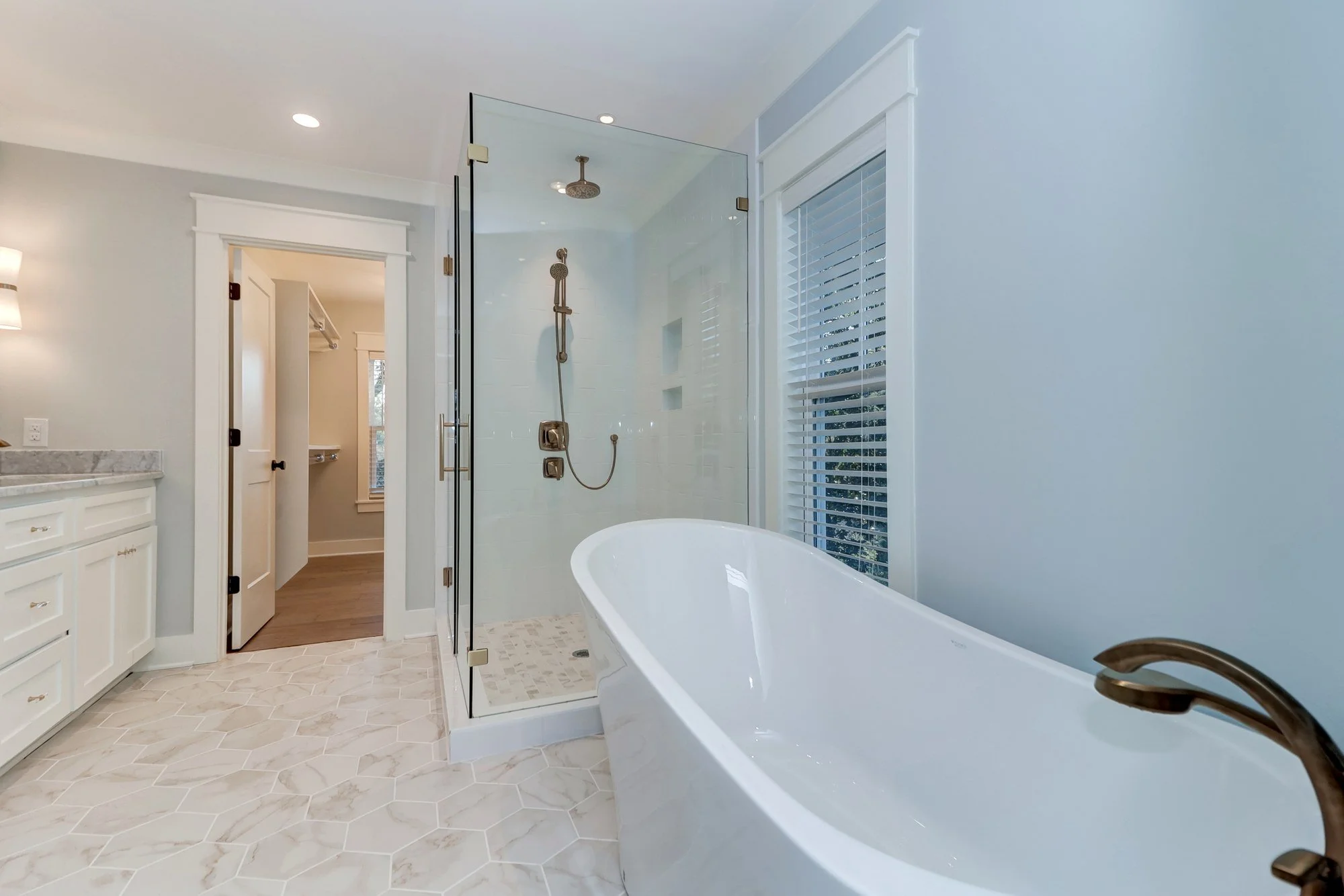 Owners bath with a freestanding soaking tub in an Old Village Mount Pleasant SC home