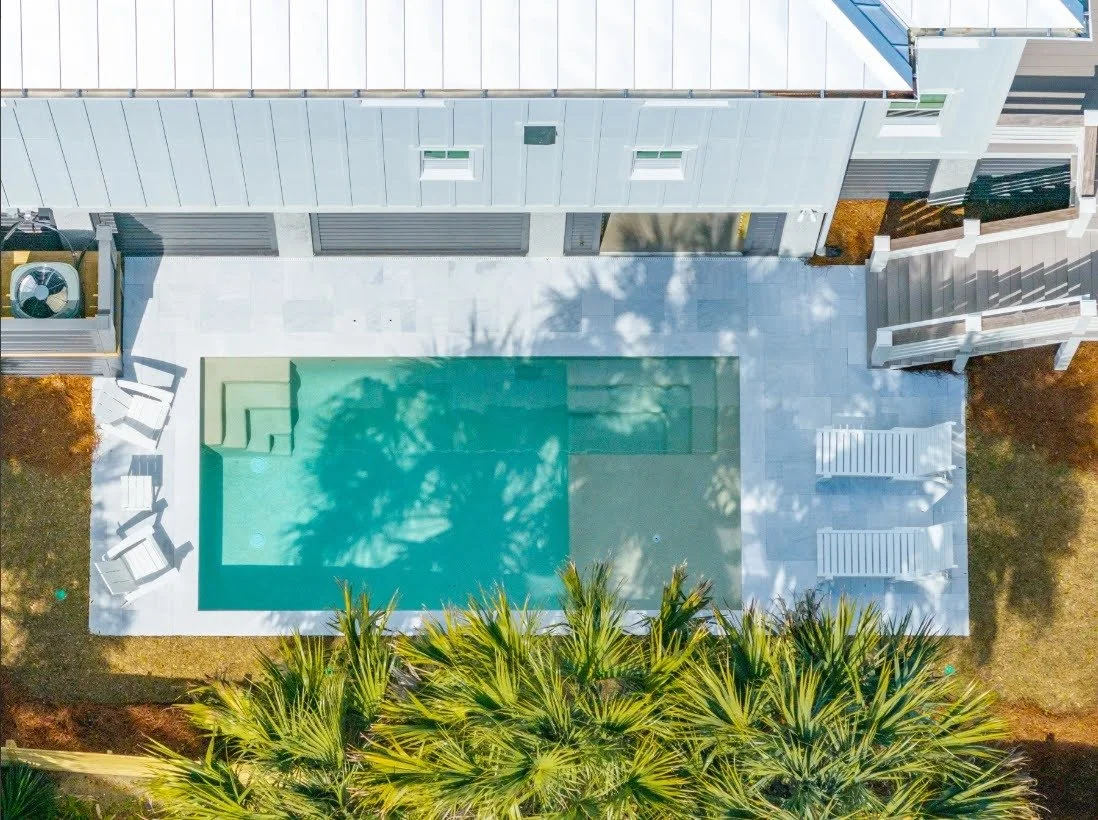 Aerial view of the pool and metal roofline at an Isle of Palms SC custom home build