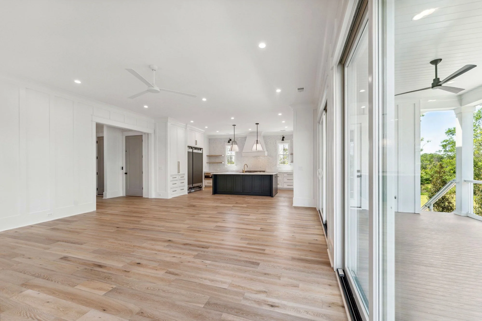 Great room opening to the kitchen in an elevated Daniel Island SC coastal custom home