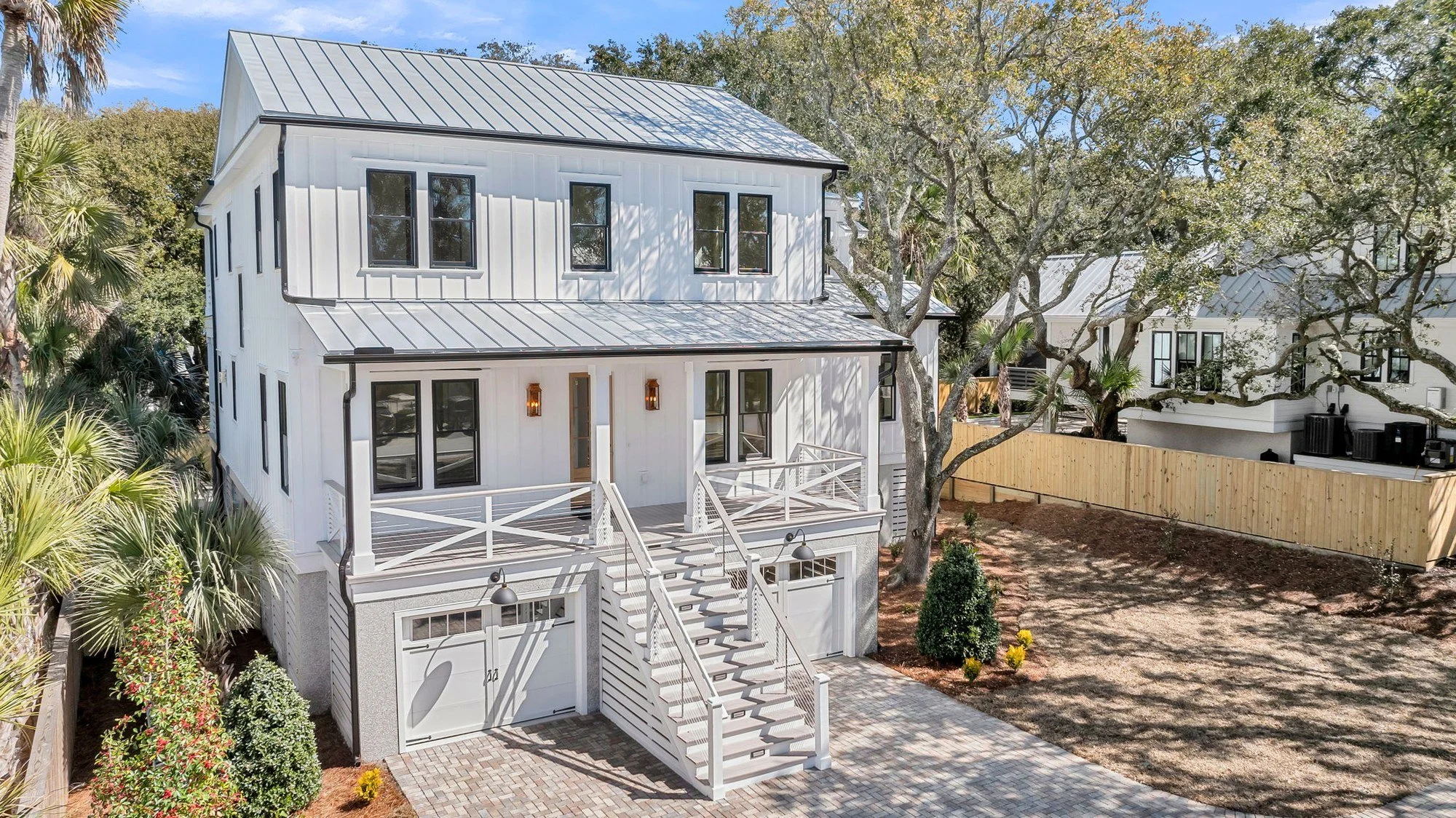 Side elevation with black-framed windows on an elevated Isle of Palms SC custom home