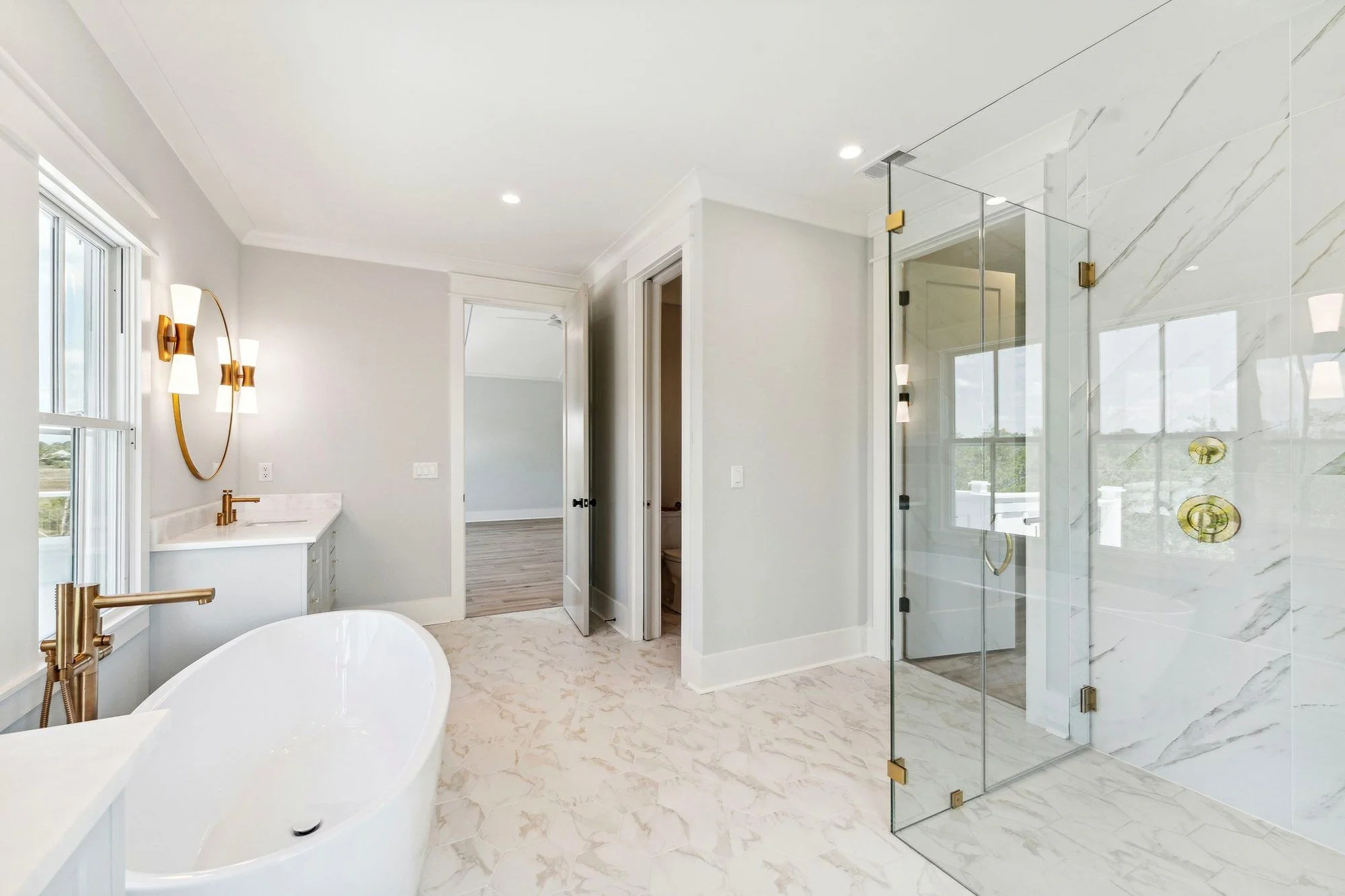 Primary bath with freestanding tub and frameless glass shower in Daniel Island SC