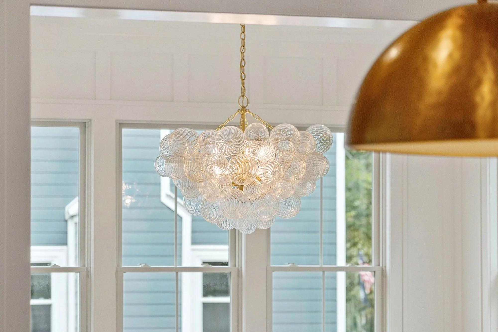 Dining room chandelier in a luxury Isle of Palms SC home built by Iconic Developments