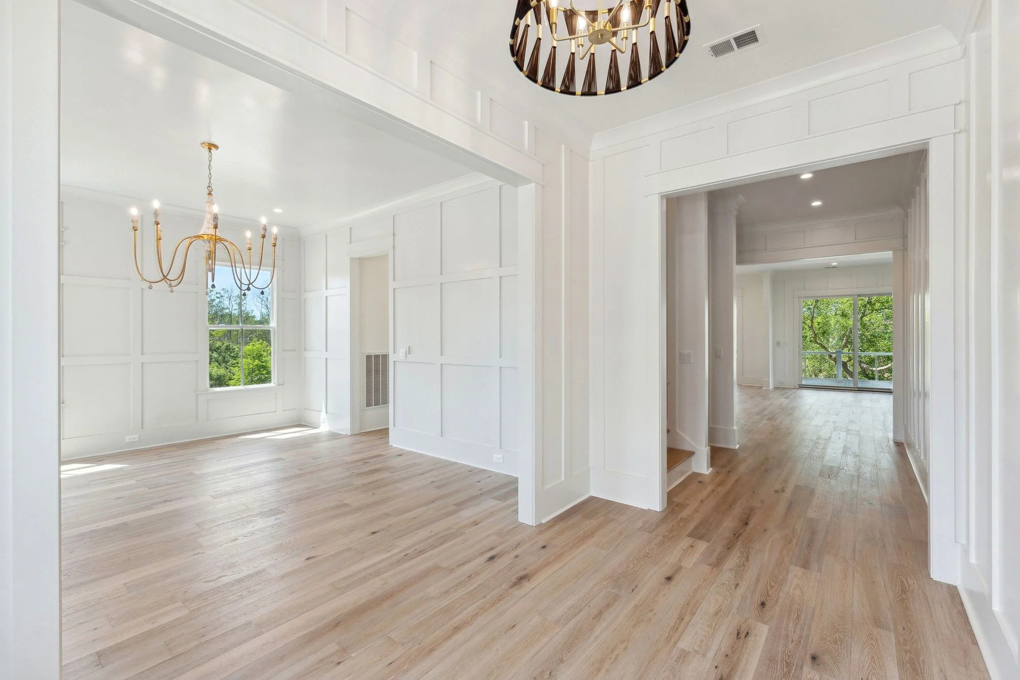 Formal dining room with full-height paneling in a Daniel Island SC luxury custom home