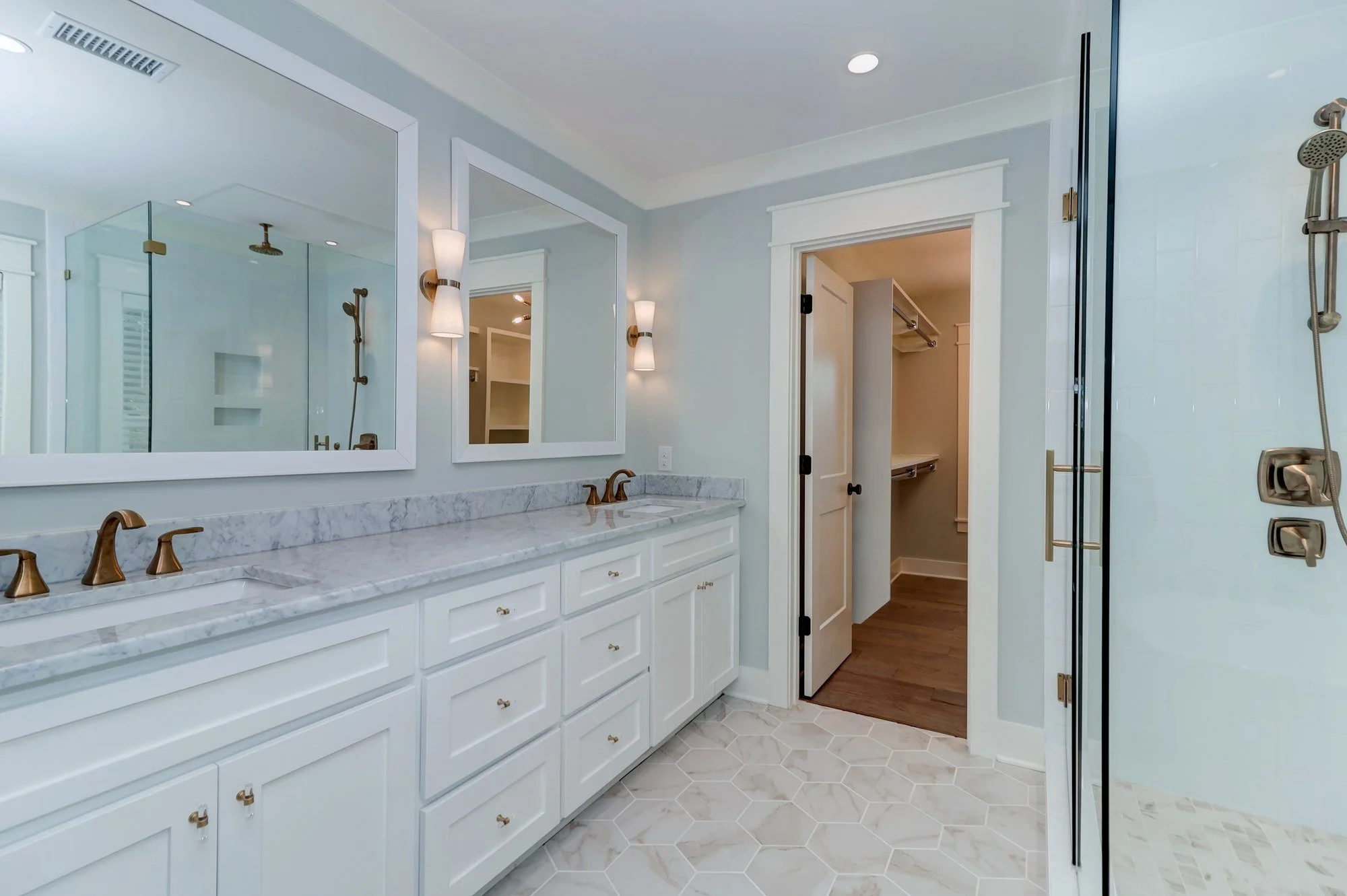 Owners bath double vanity with custom cabinetry in a Charleston SC luxury home build