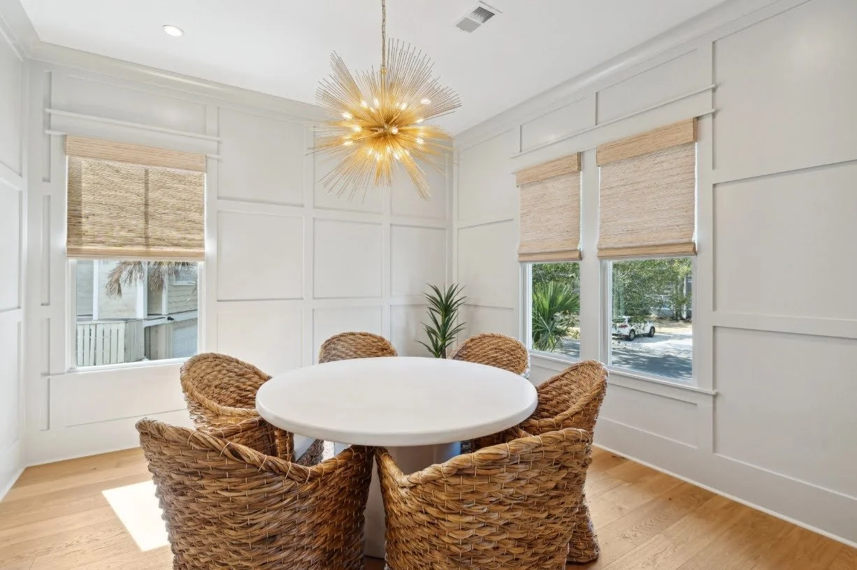 Formal dining room with starburst chandelier in a luxury Isle of Palms SC custom home