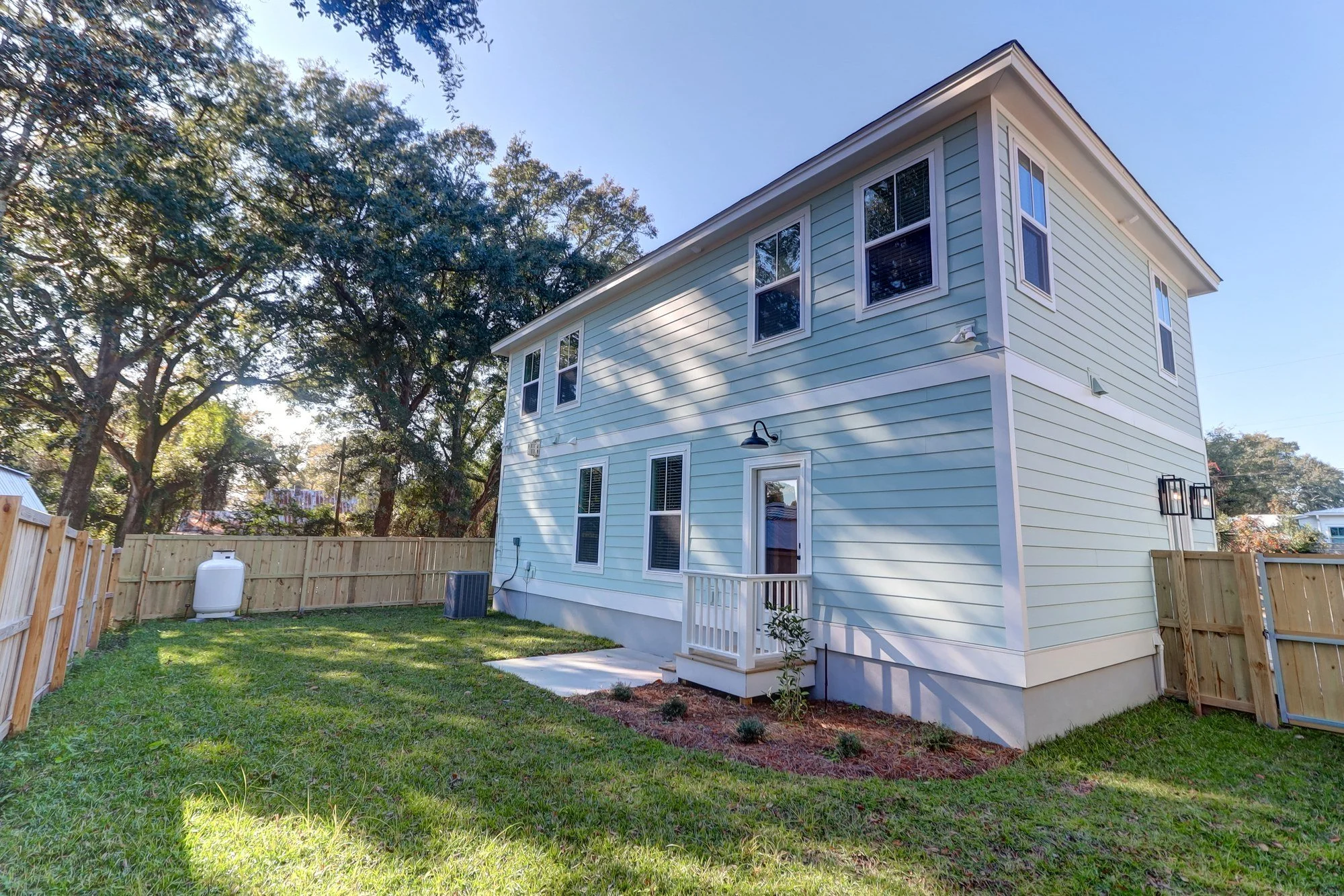 Rear elevation and fenced yard at an Old Village Mount Pleasant SC custom home build