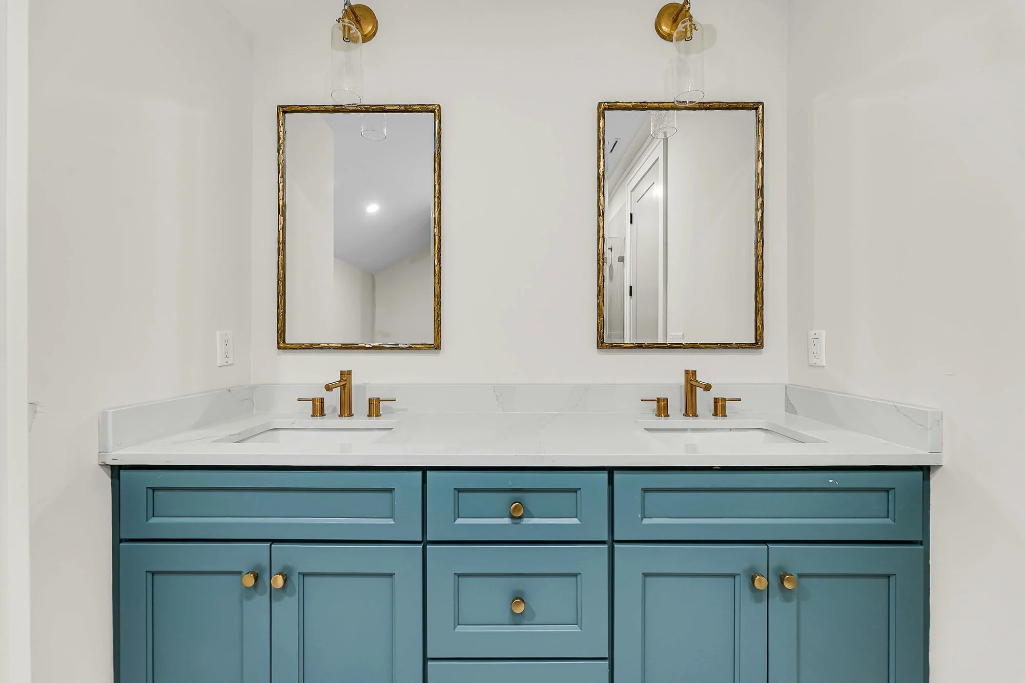 Guest bath with custom double vanity in an Isle of Palms SC home by Iconic Developments