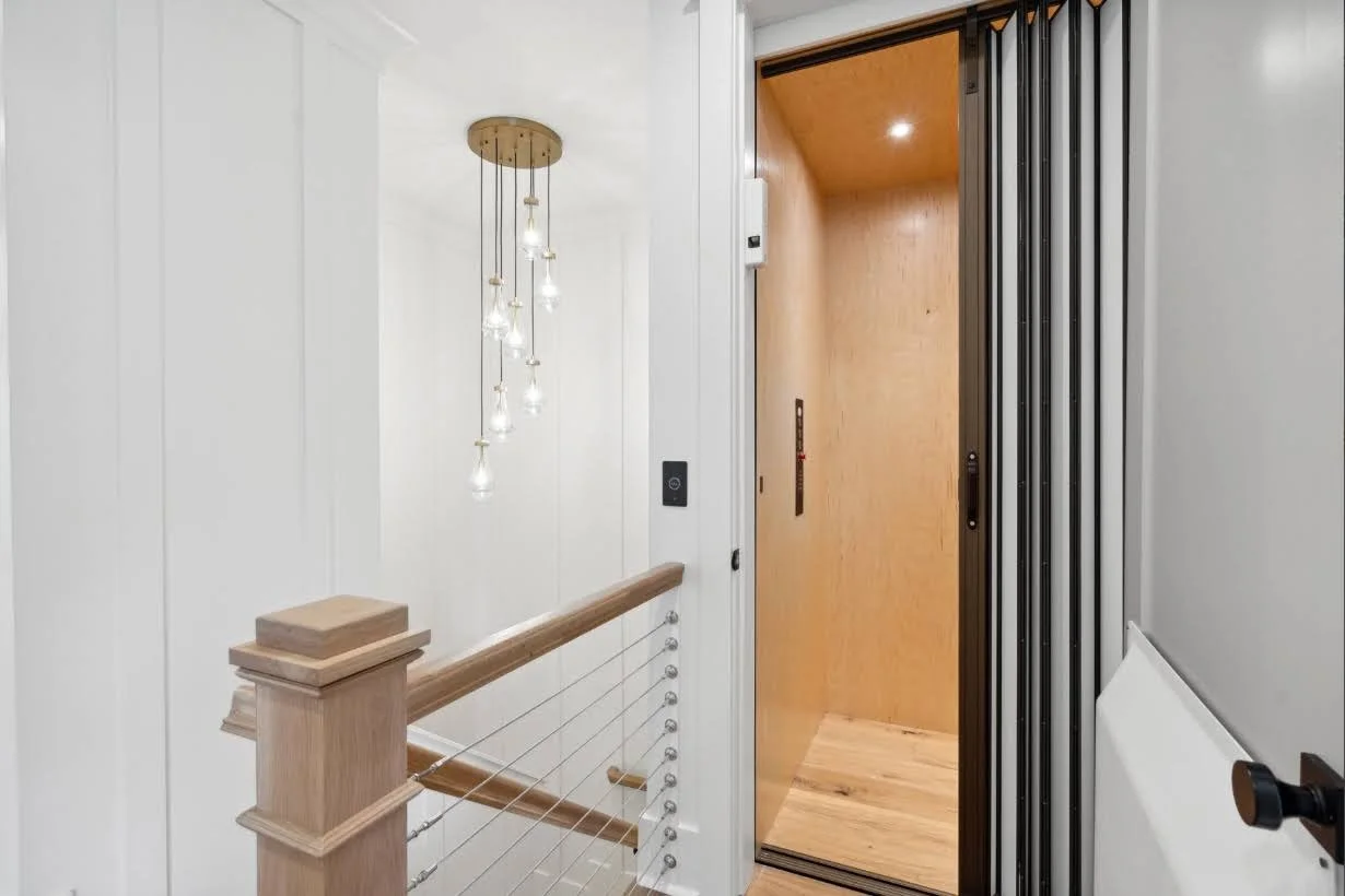 Residential elevator inside an elevated Isle of Palms SC home by Iconic Developments
