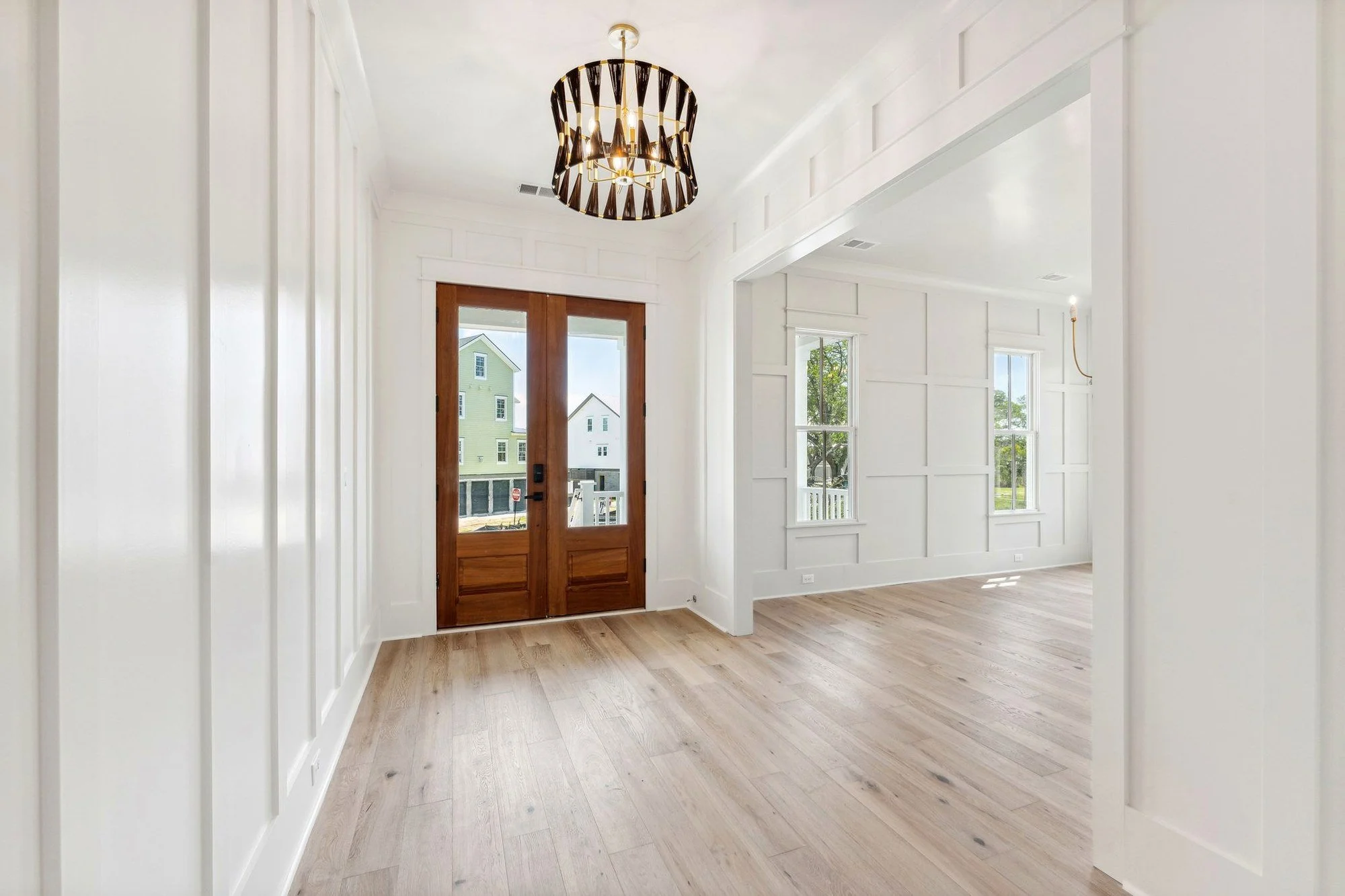 Paneled entry hall with board and batten millwork in a Daniel Island SC custom home