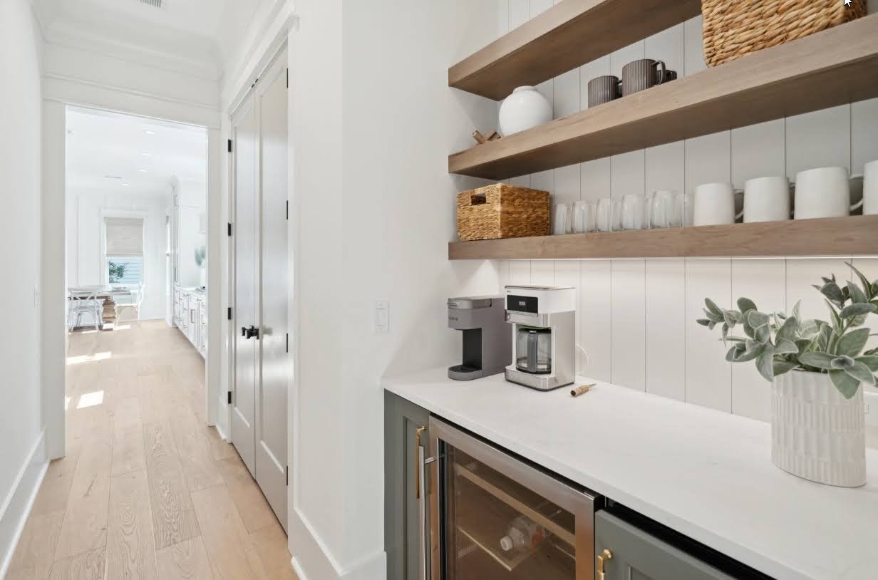 Butler pantry with open shelving in an Isle of Palms SC home by Iconic Developments