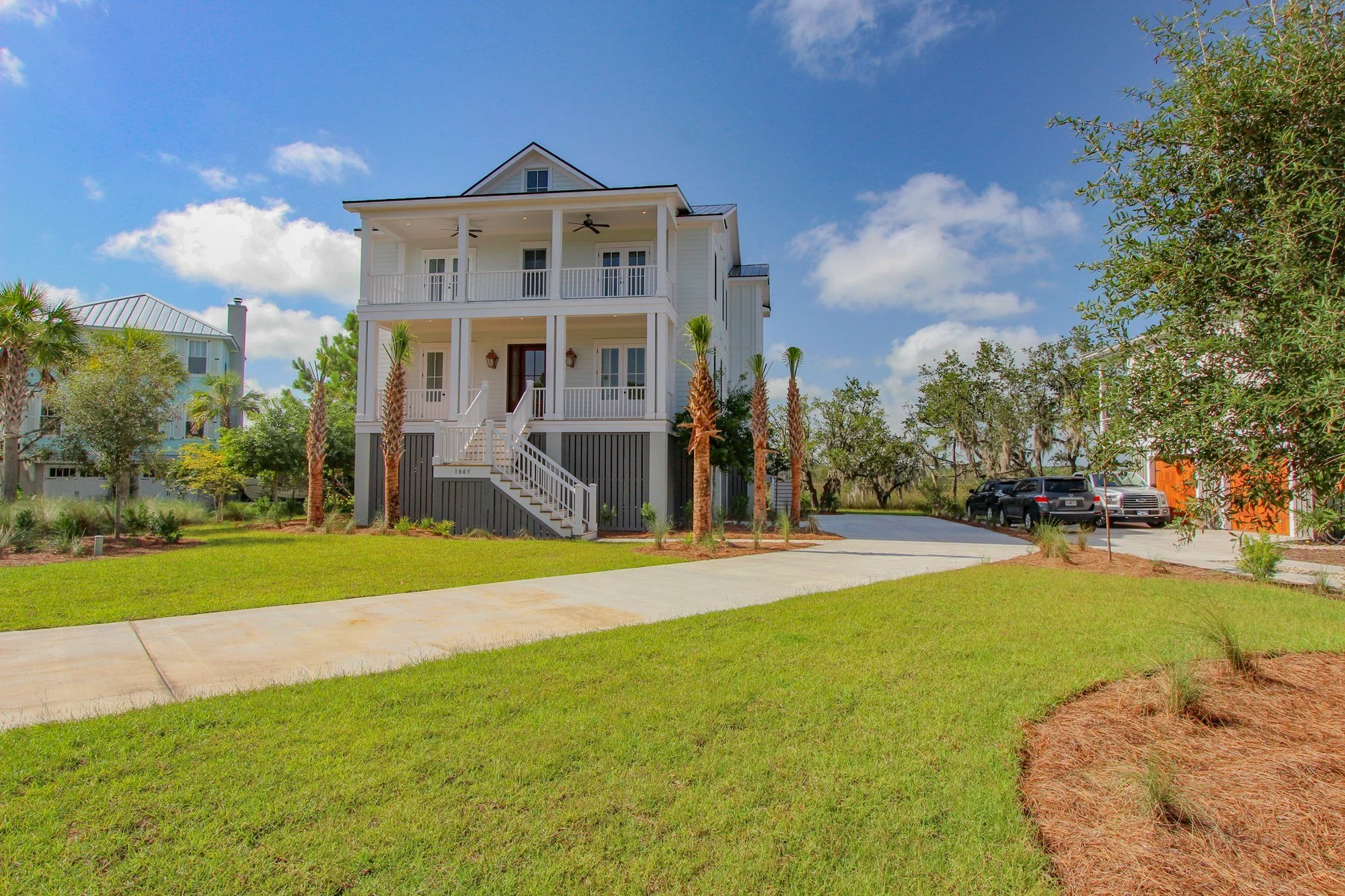 Raised Lowcountry custom home streetscape on Rushland Grove Lane Johns Island SC