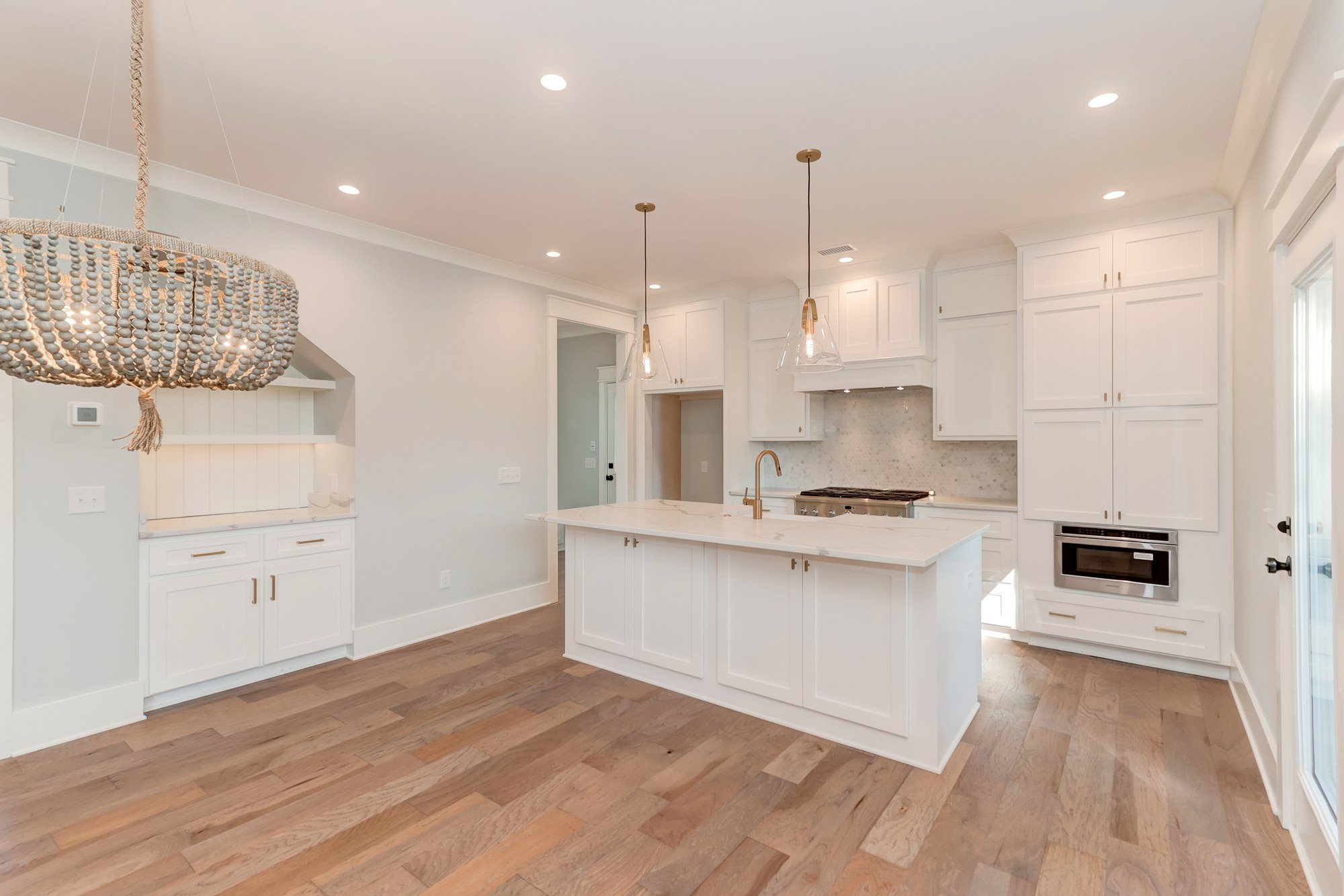 Custom kitchen with quartz island in an Old Village Mount Pleasant SC luxury home