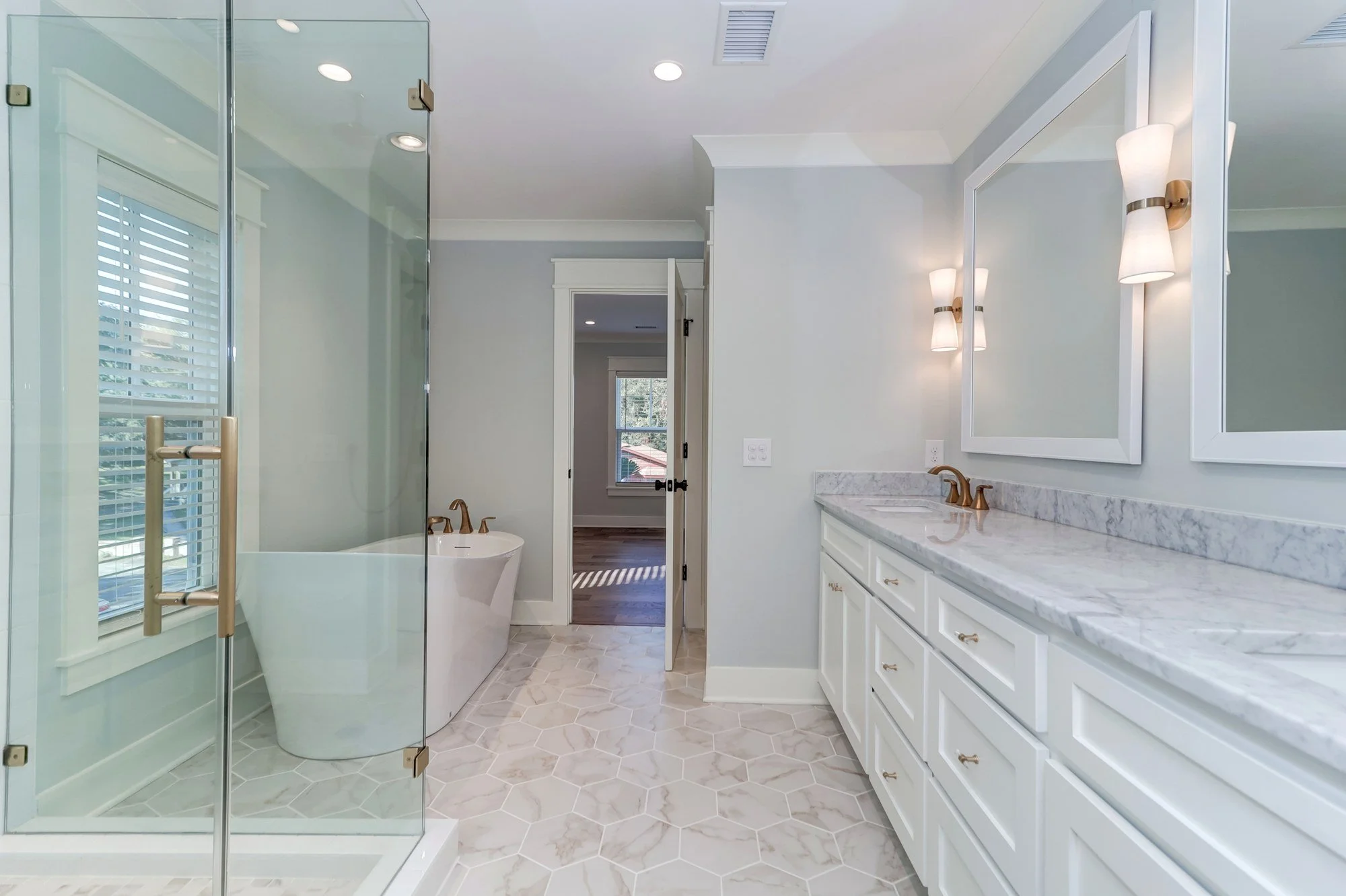 Owners bath with double vanity and soaking tub in a Mount Pleasant SC custom home