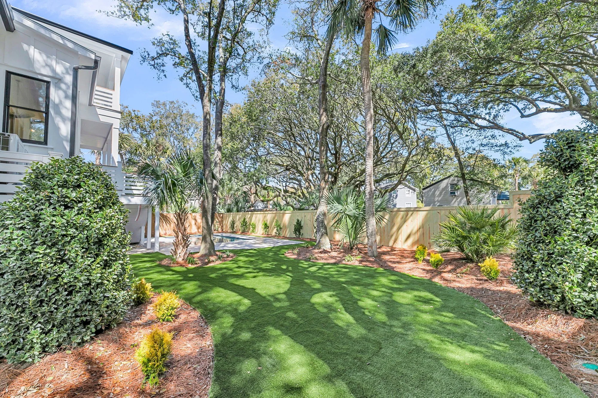 Private rear yard shaded by live oaks at a custom Isle of Palms SC coastal home build