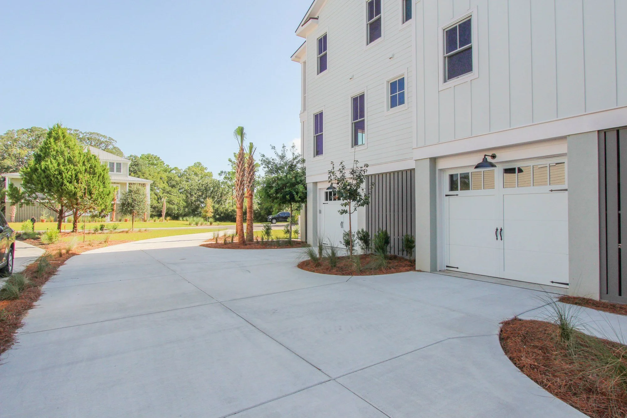 Carriage garage doors and drive-under garage on a custom Charleston SC home build