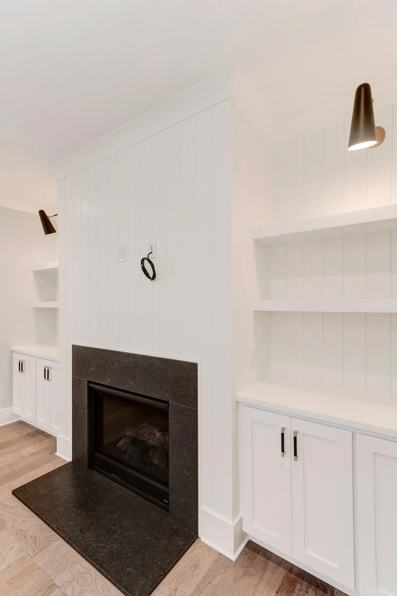 Fireplace and custom built-in cabinetry detail in a Charleston SC luxury home build