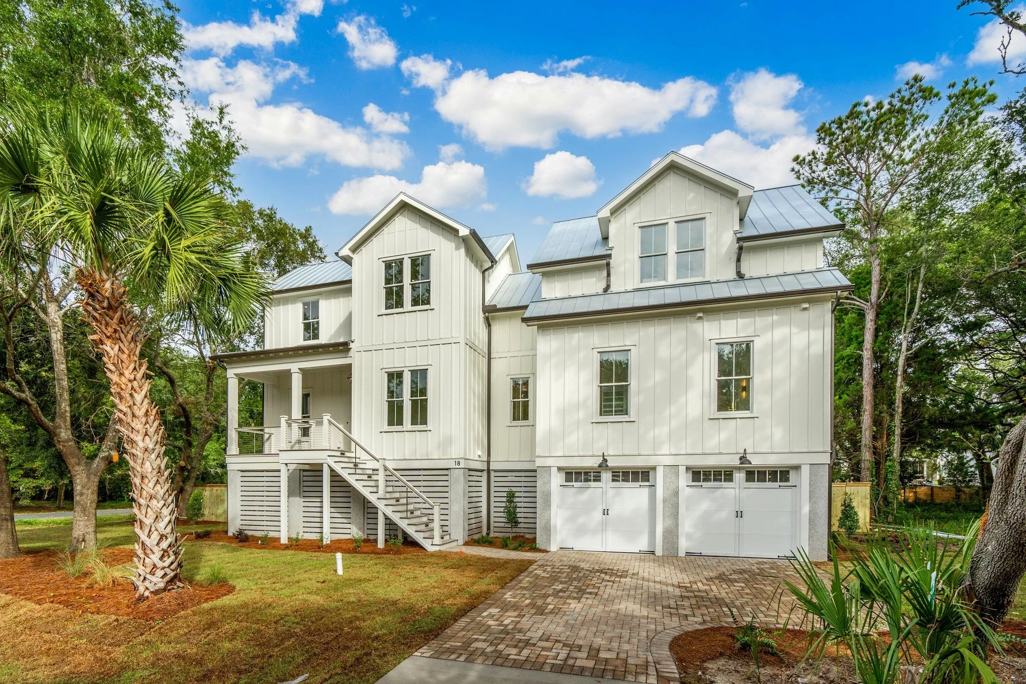 Paver driveway and elevated front elevation of an Isle of Palms SC custom home build