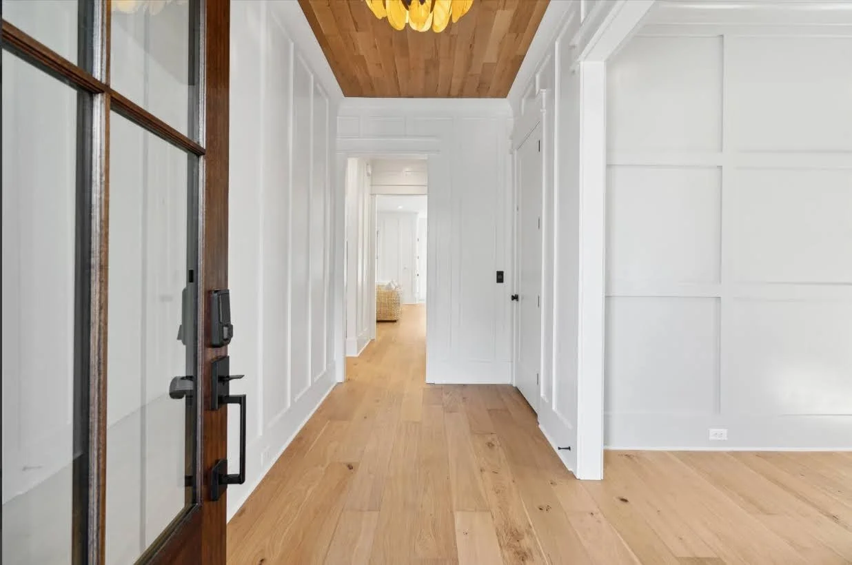 Entry foyer with wood plank ceiling detail in an Isle of Palms SC custom home build