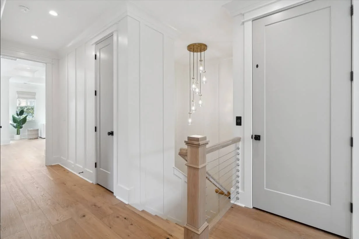 Upstairs hallway with white oak flooring in an Isle of Palms SC custom home build