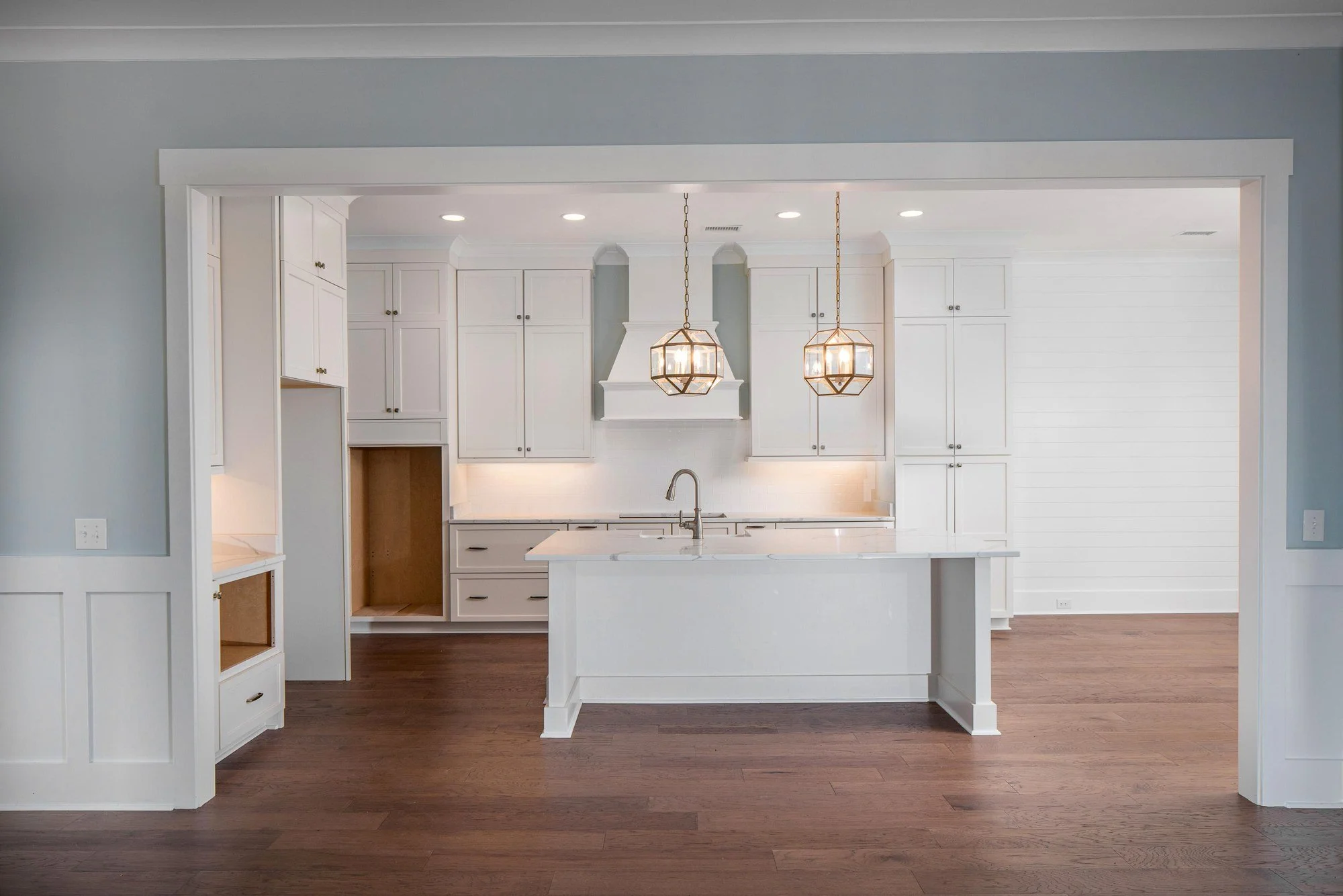 Open custom kitchen viewed from the living room in a Johns Island SC luxury home build