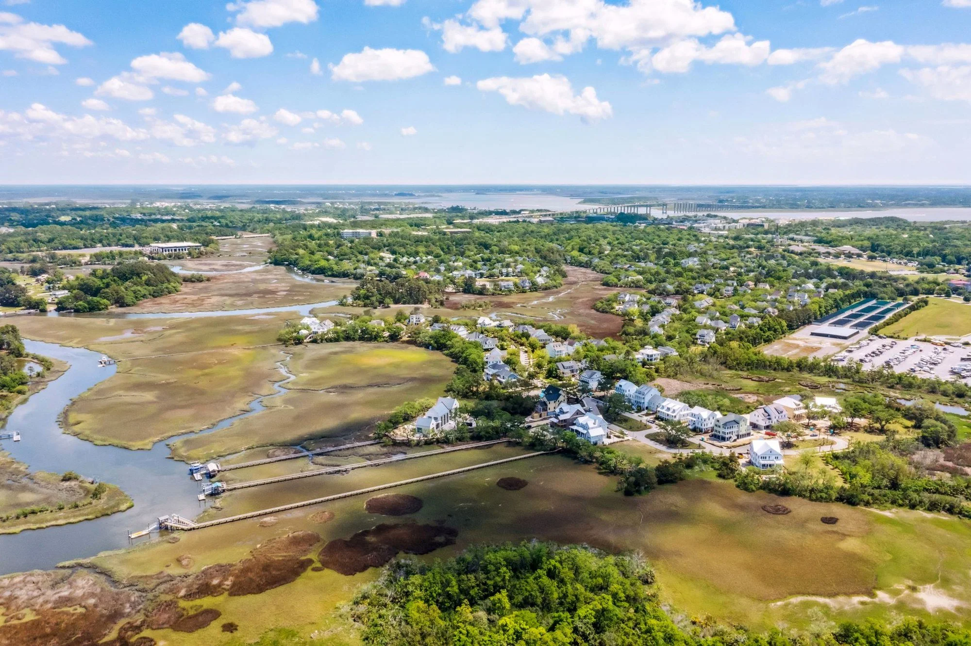 Aerial of Daniel Island SC neighborhood dock and marsh boardwalk near a custom home build